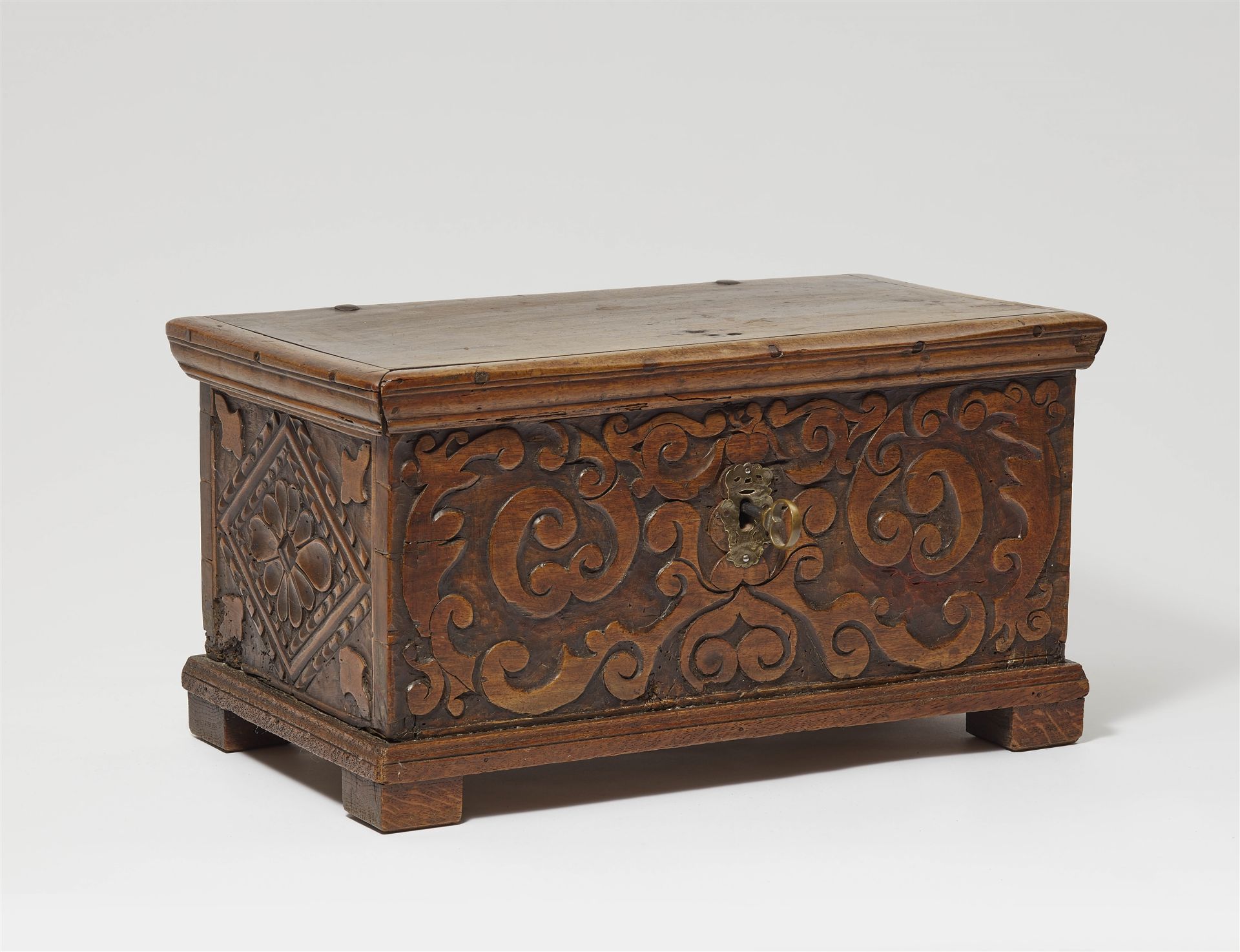 A carved walnut chest