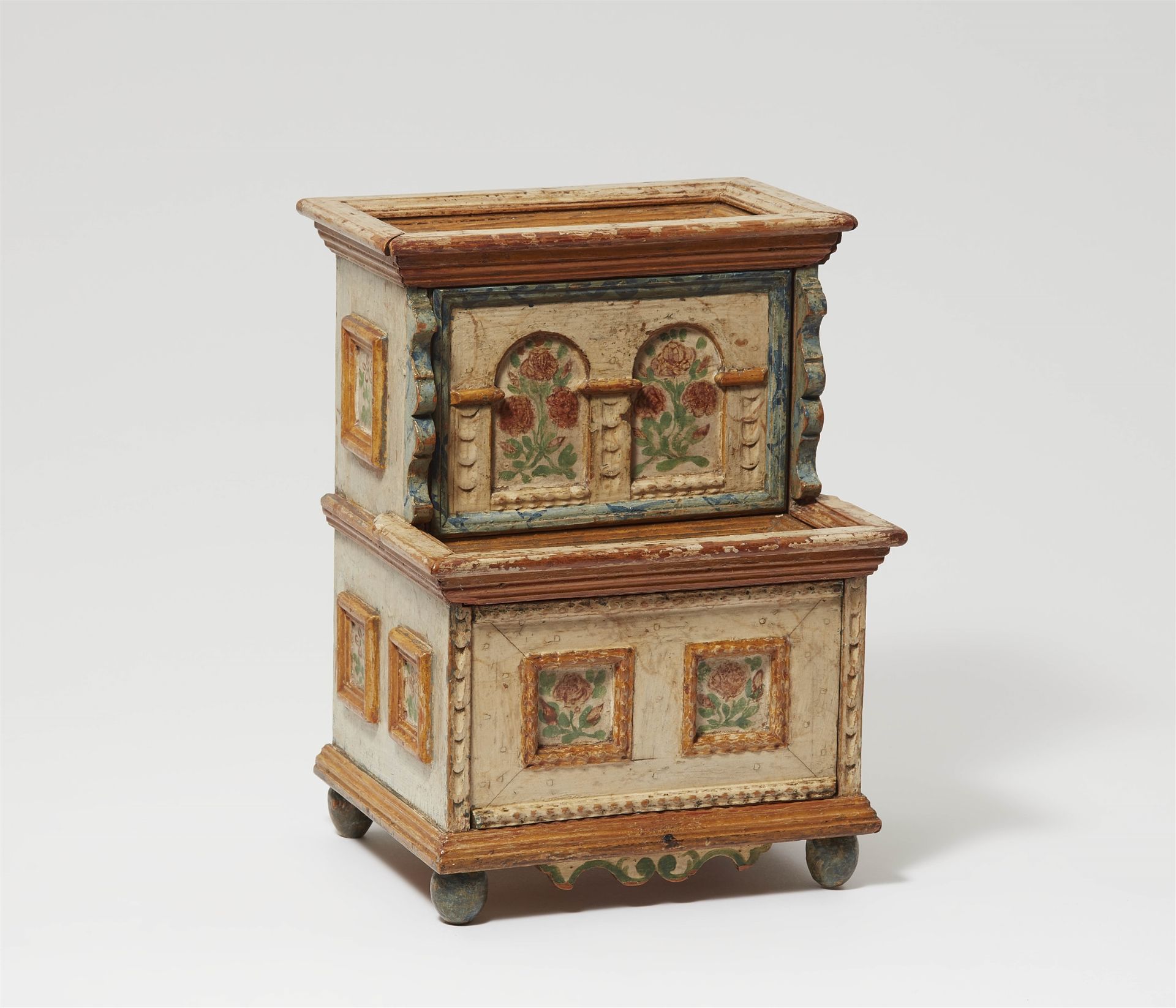 A small coffer shaped like a miniature cabinet