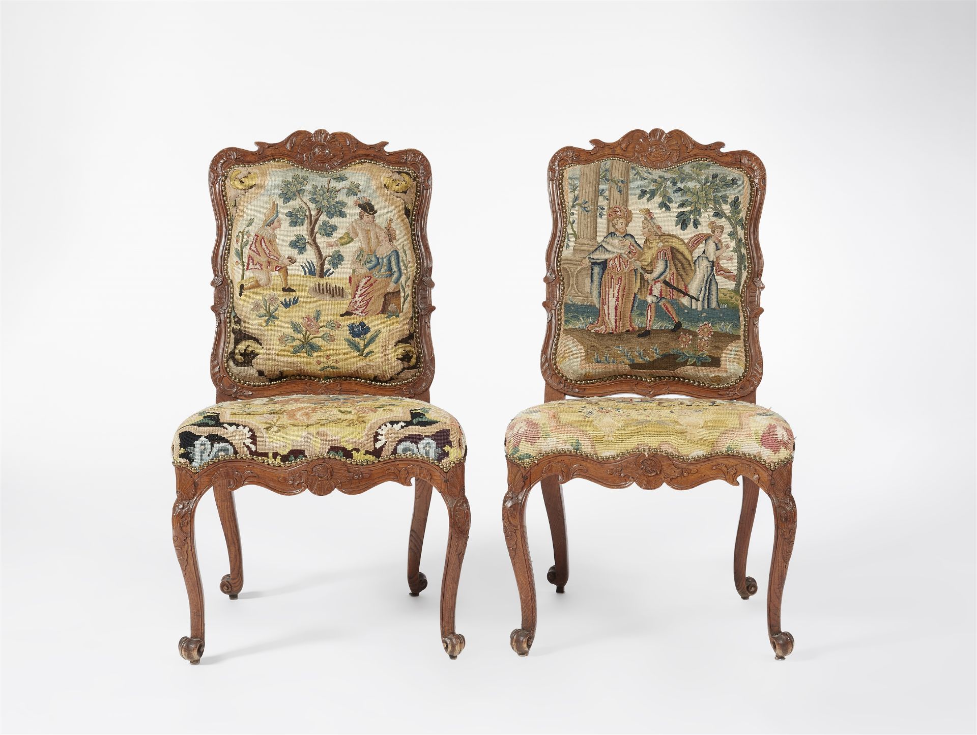 A pair of Régence carved oak chairs