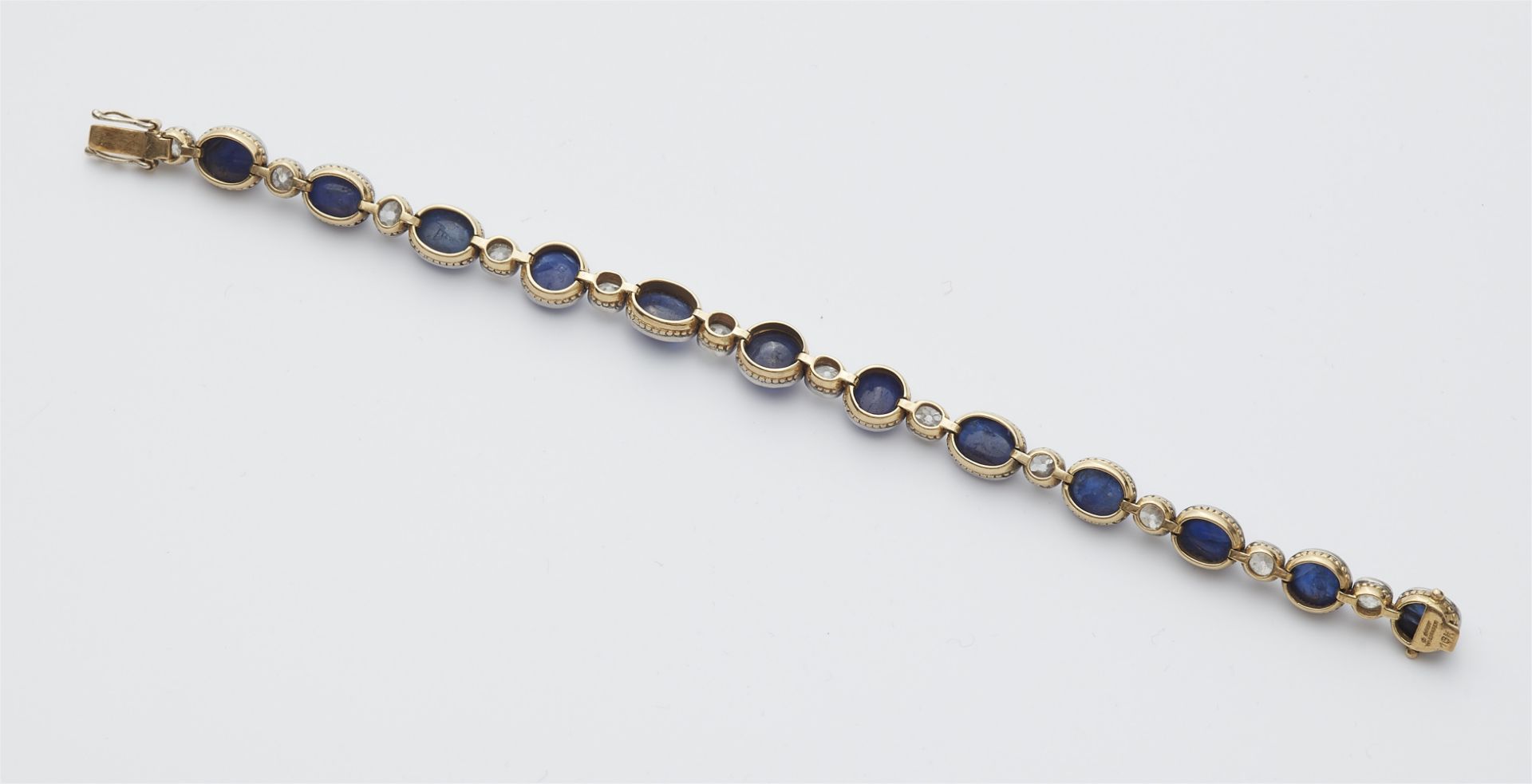 A German Belle Epoque 18k gold diamond and sapphire cabochon bracelet. - Image 2 of 2