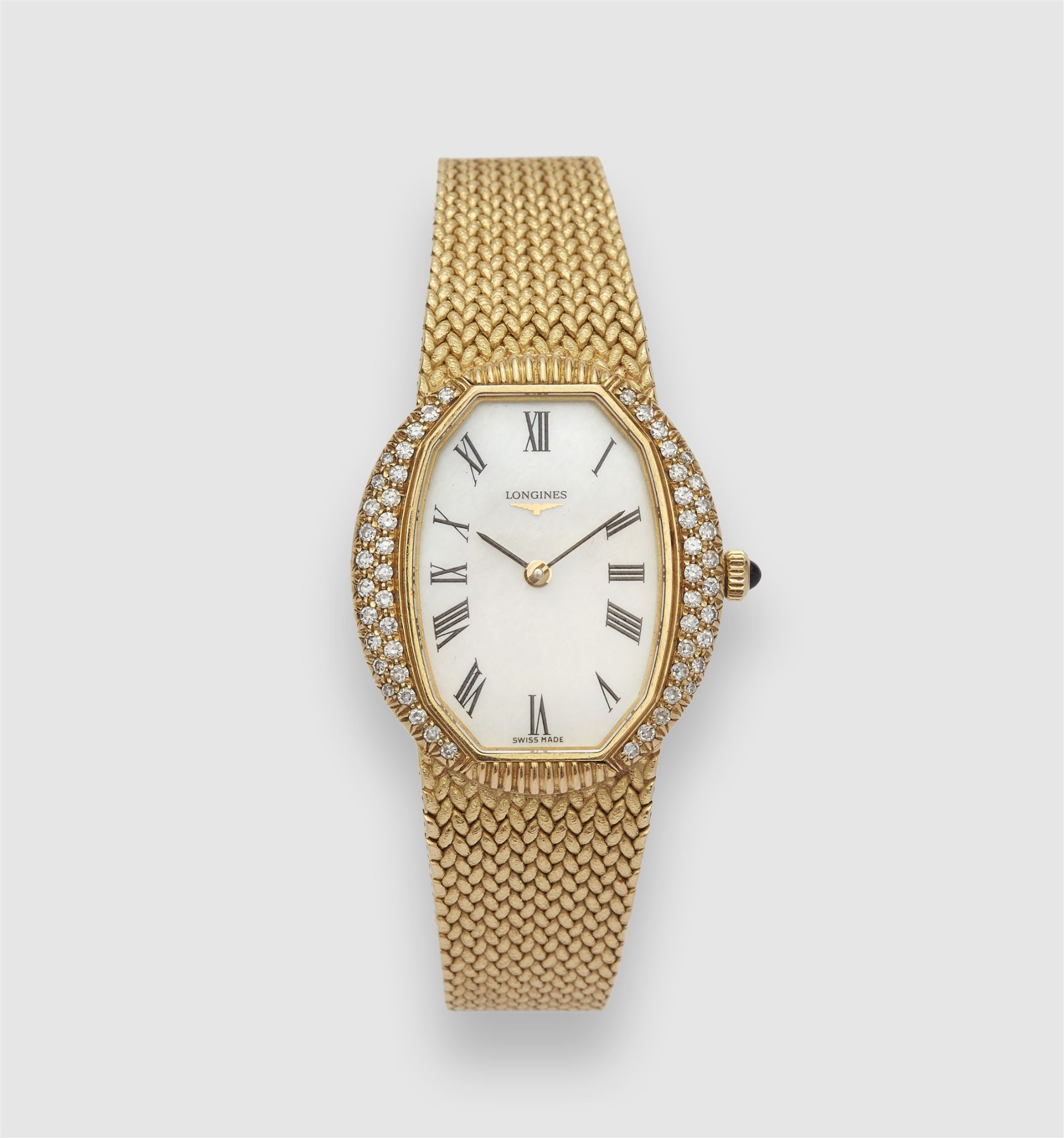 An 18k gold Longines manually wound ladies wristwatch.