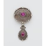A 14k gold, diamond and Burma ruby pendant brooch.