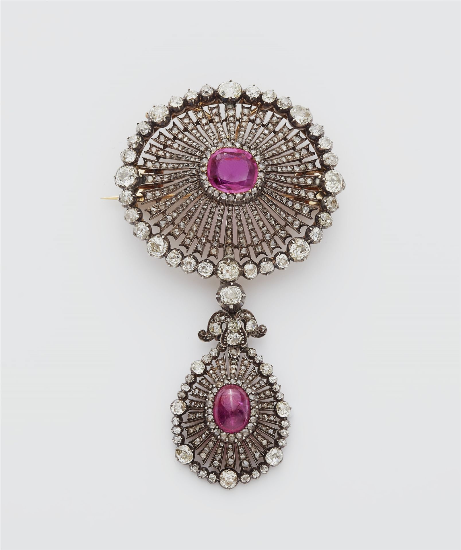 A 14k gold, diamond and Burma ruby pendant brooch.