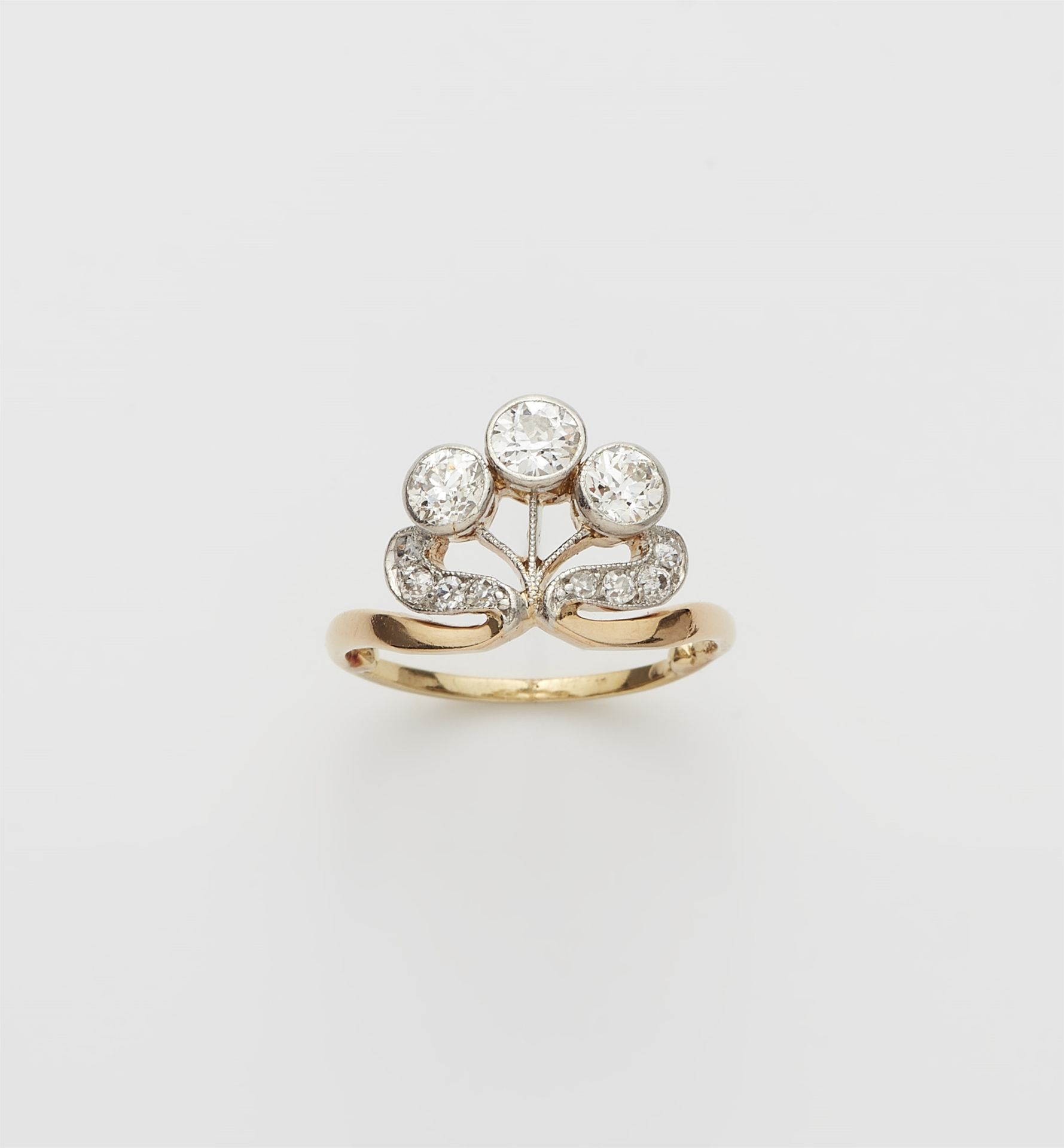 An 14k gold and diamond Art Nouveau ring.