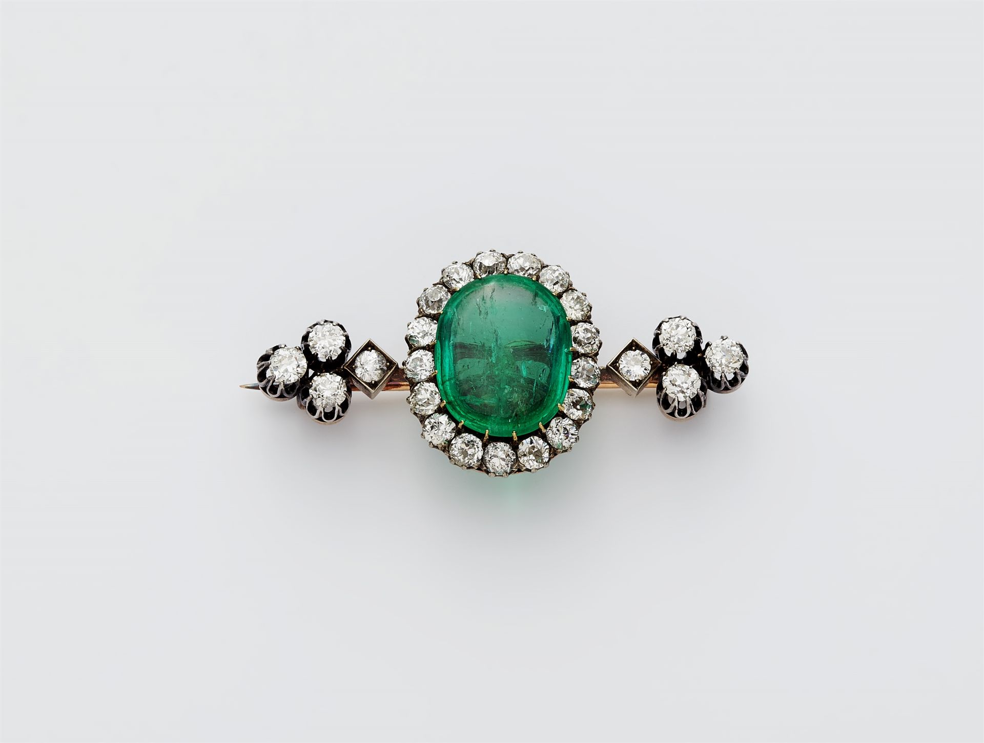 A late 19th century 14k gold and diamond pin brooch with a detachable fine emerald.