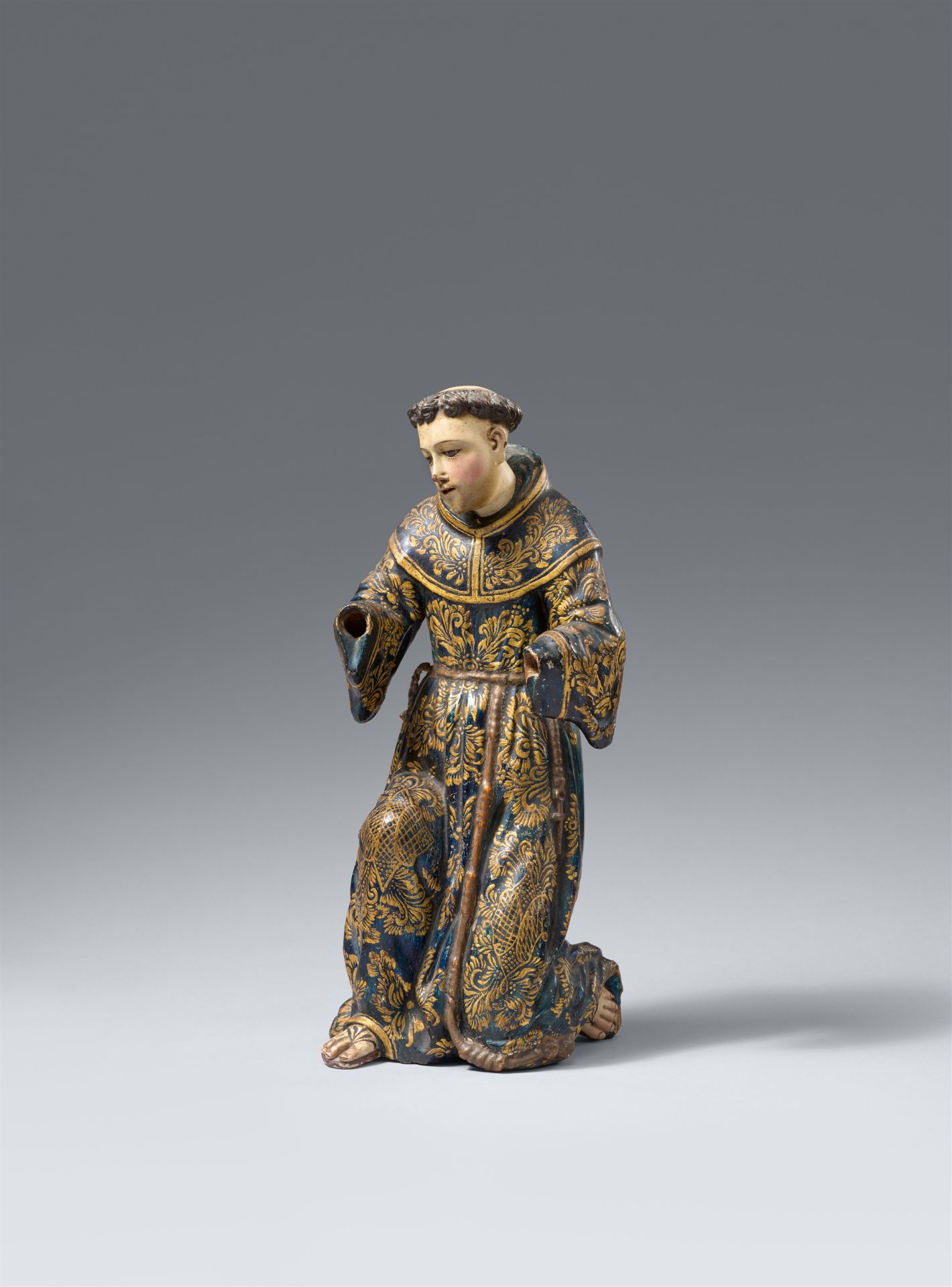 A carved wood figure of Saint Francis (?), Iberian-Colonial, 18th century