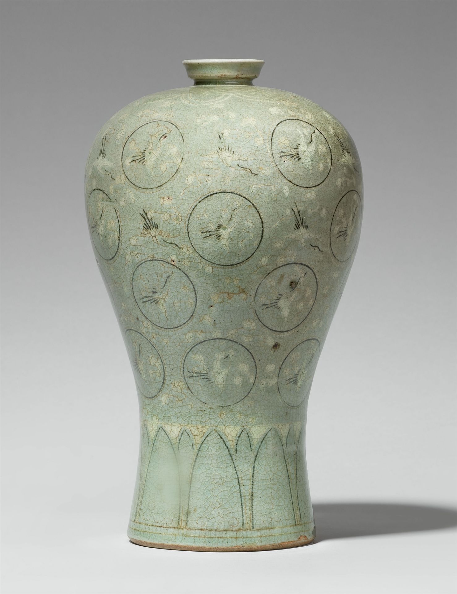 A Korean Goryeo style celadon prunus (maebyeong) vase with inlaid cloud and crane design