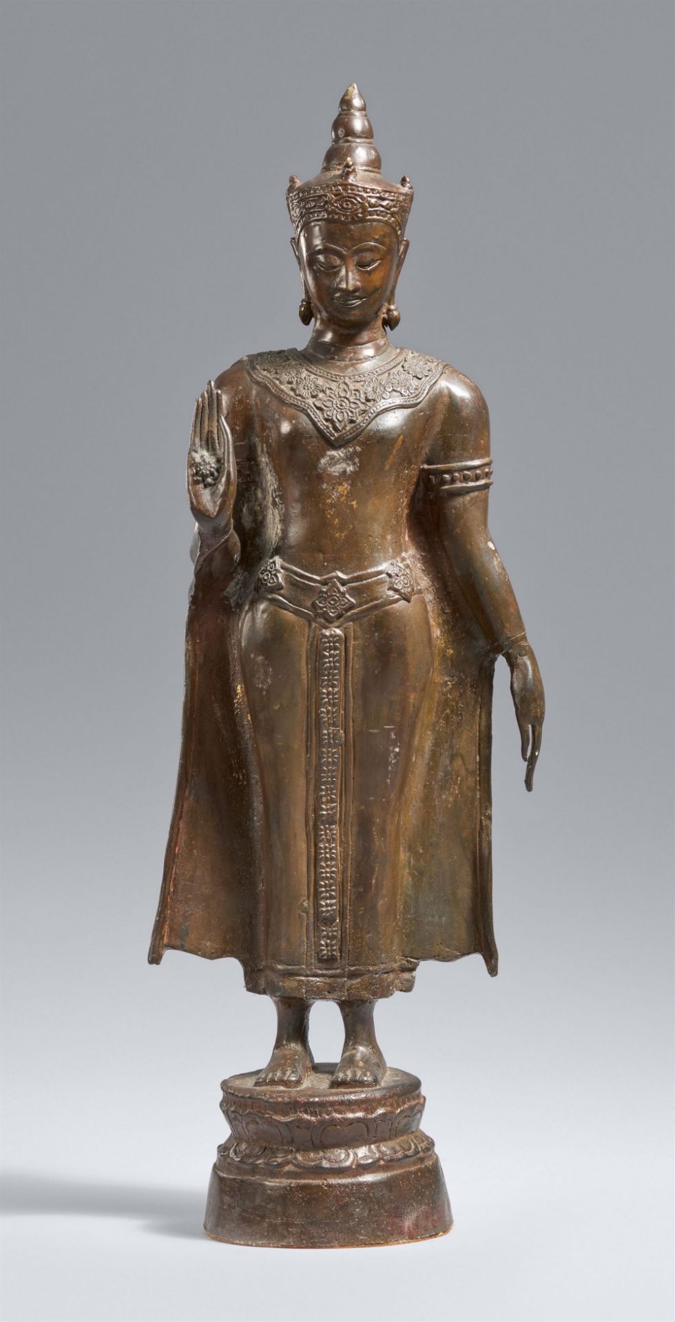 An Ayutthaya-style bronze figure of a crowned and bejewelled Buddha. Thailand. 17th century or later