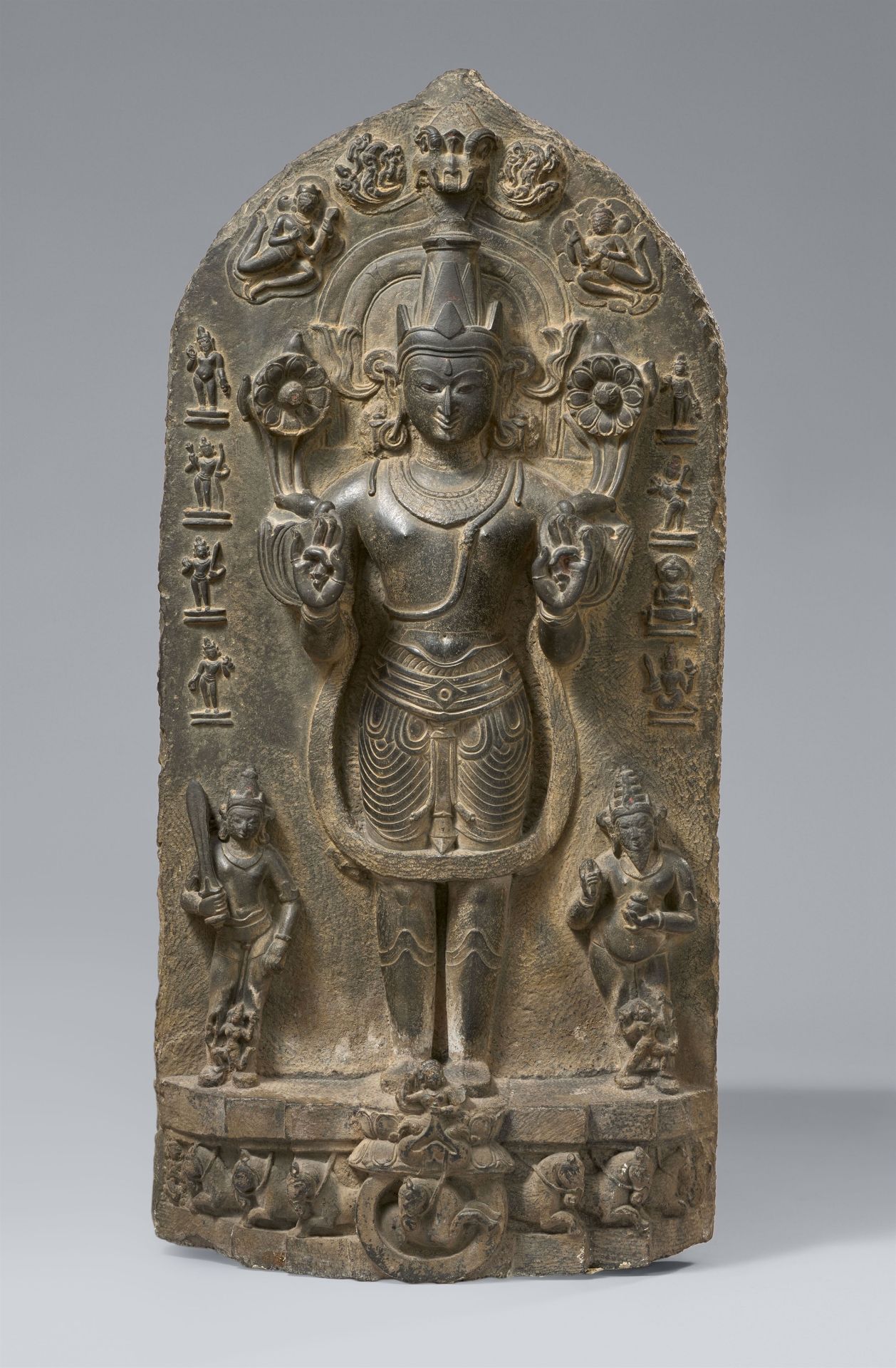 A large black stone Pala stele of Surya. Northeast-India, Bihar. 11th/12th century