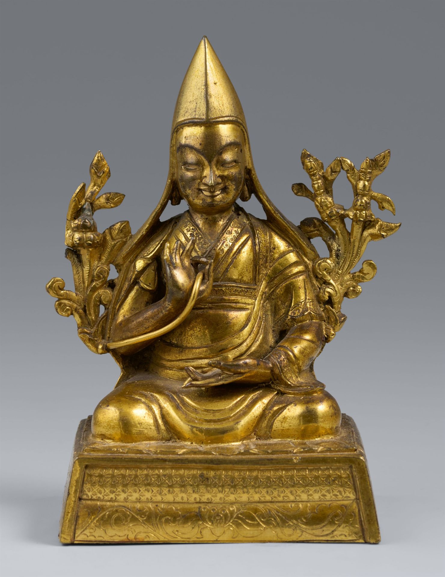 A gilt bronze figire of a lama. Southern Tibet. 18th century