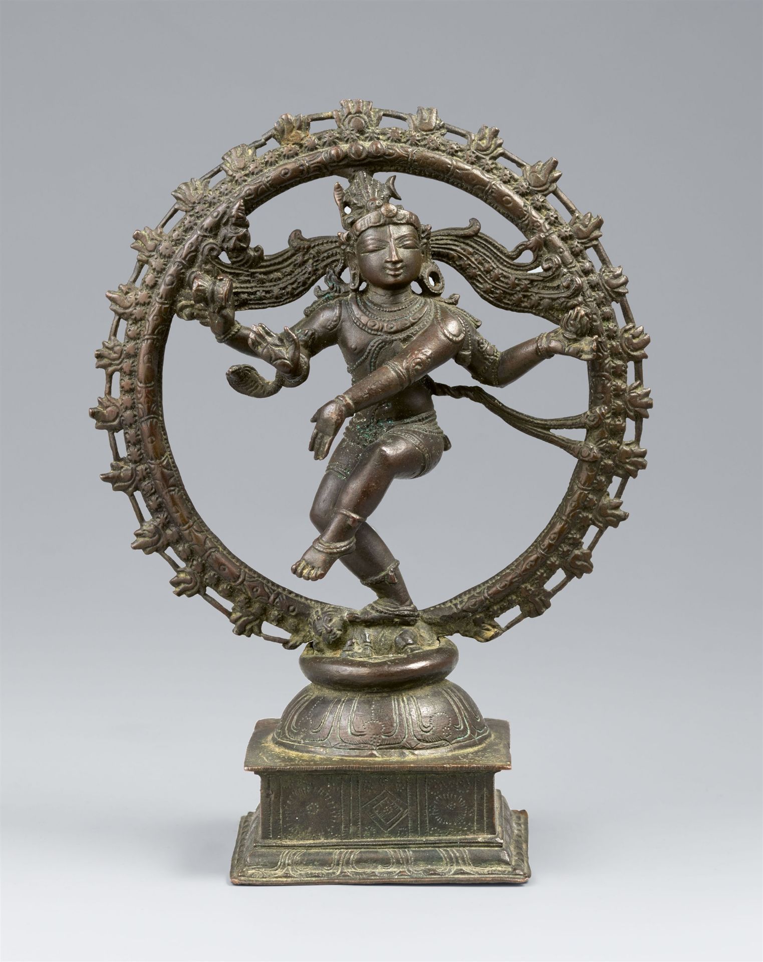 A Chola style copper alloy figure of Shiva Nataraja within a flaming aureole. Southern India. 19th c