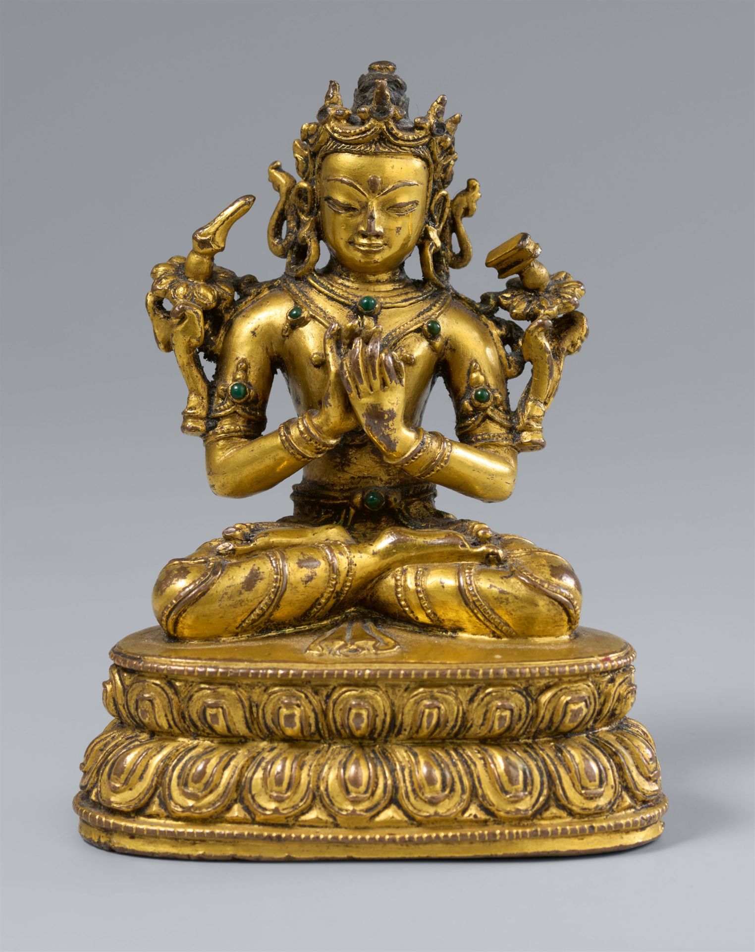 A gilt bronze figure of Dharmacakramanjusri. Tibet. In the style of the 16th century