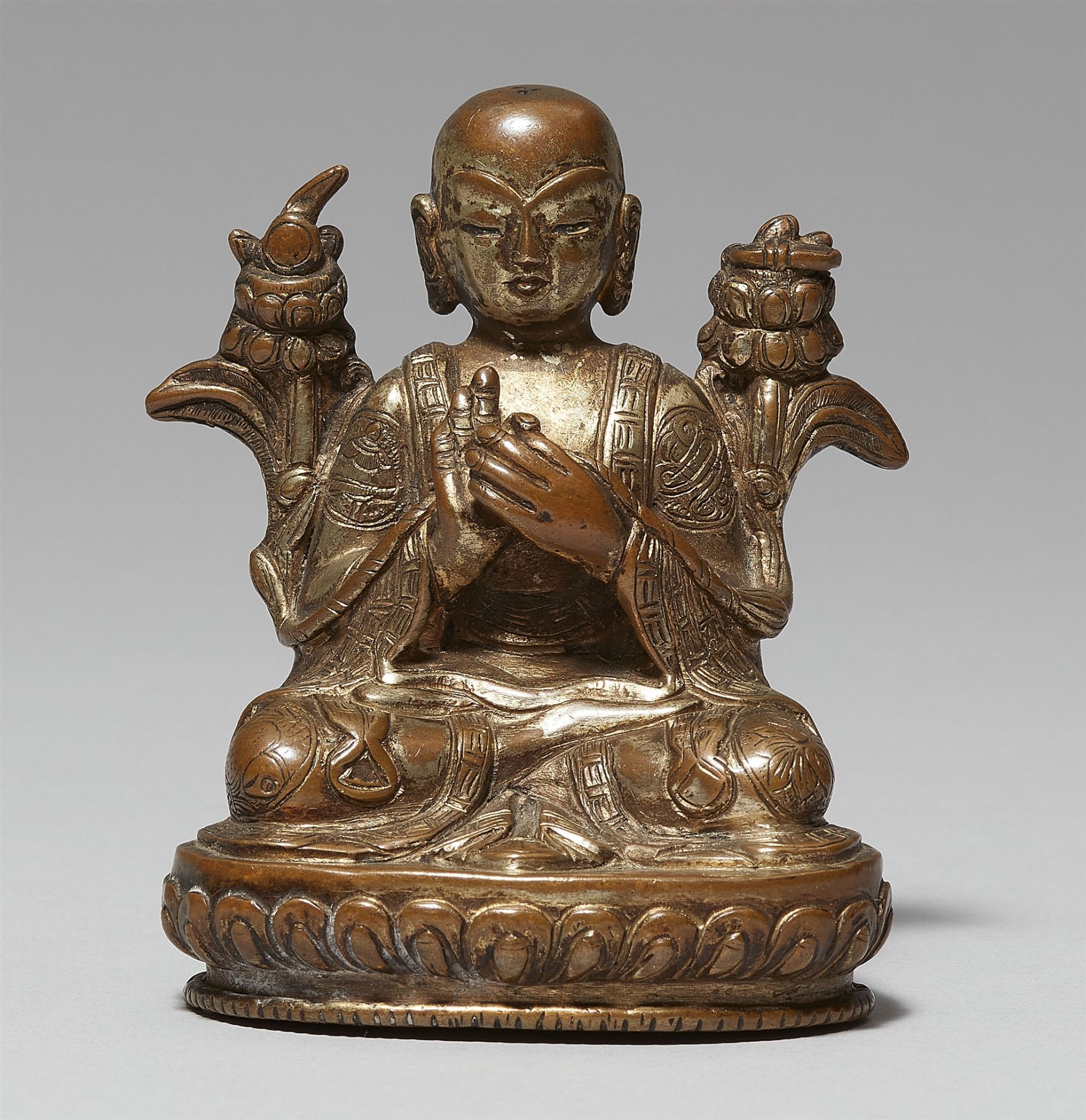 A Sinotibetan gilt bronze figure of Tsongkhapa. 19th/20th century