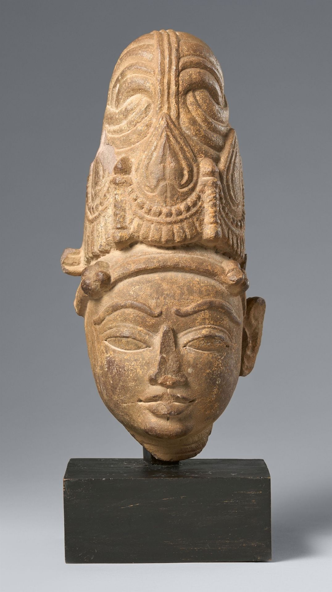 A pinkish sandstone head of Vishnu. Central India. Circa 11th century