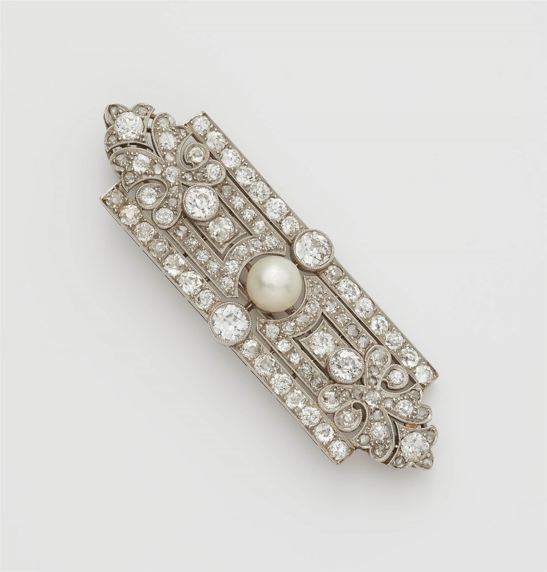 An Art Deco 18k white gold diamond and pearl brooch.