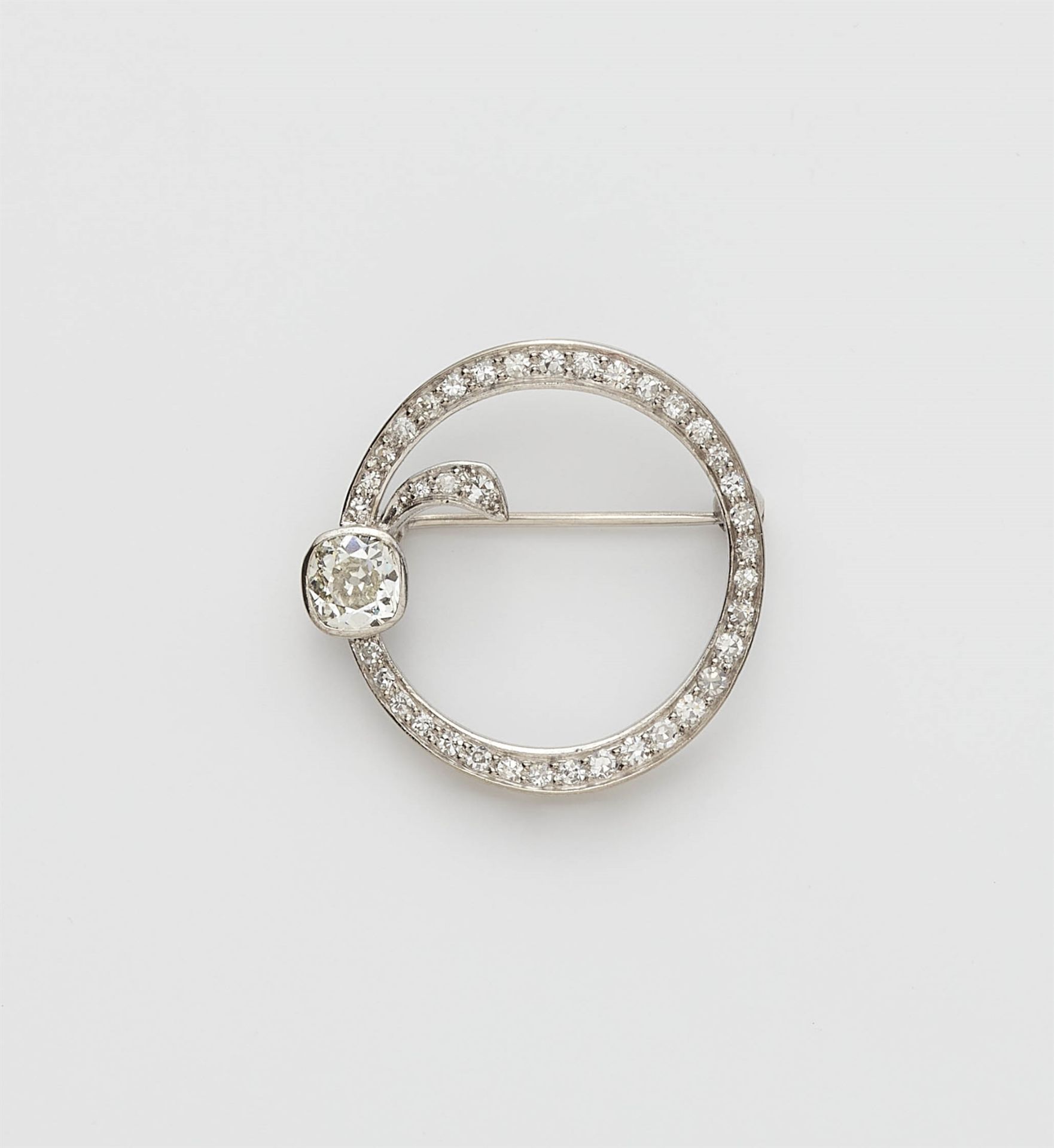 An Art Deco 18k white gold diamond brooch.
