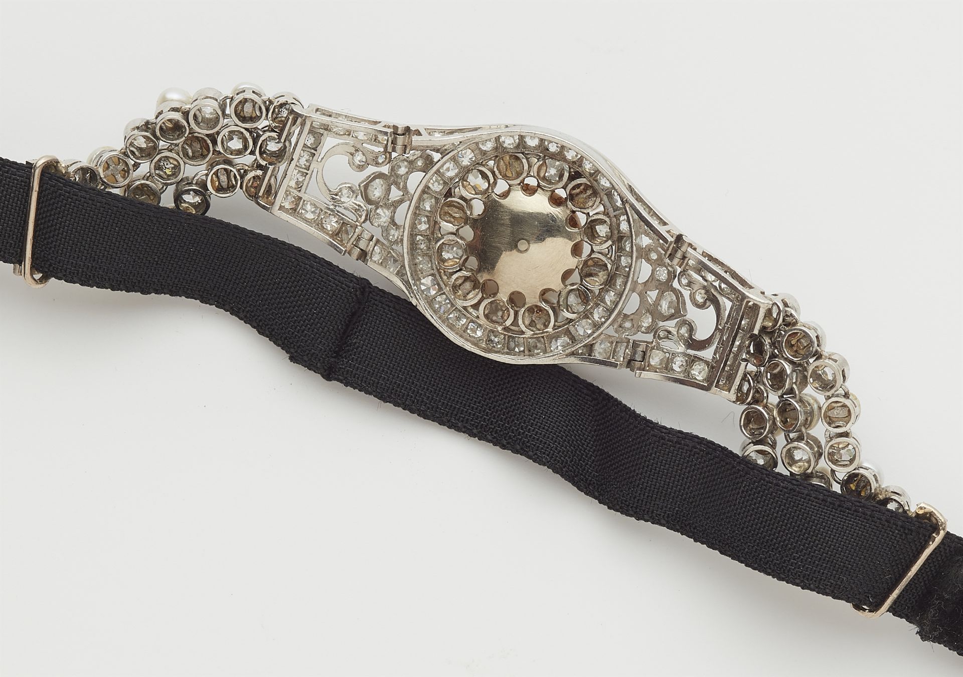 A French platinum diamond and pearl buckle bracelet with later velvet strap. - Image 2 of 2