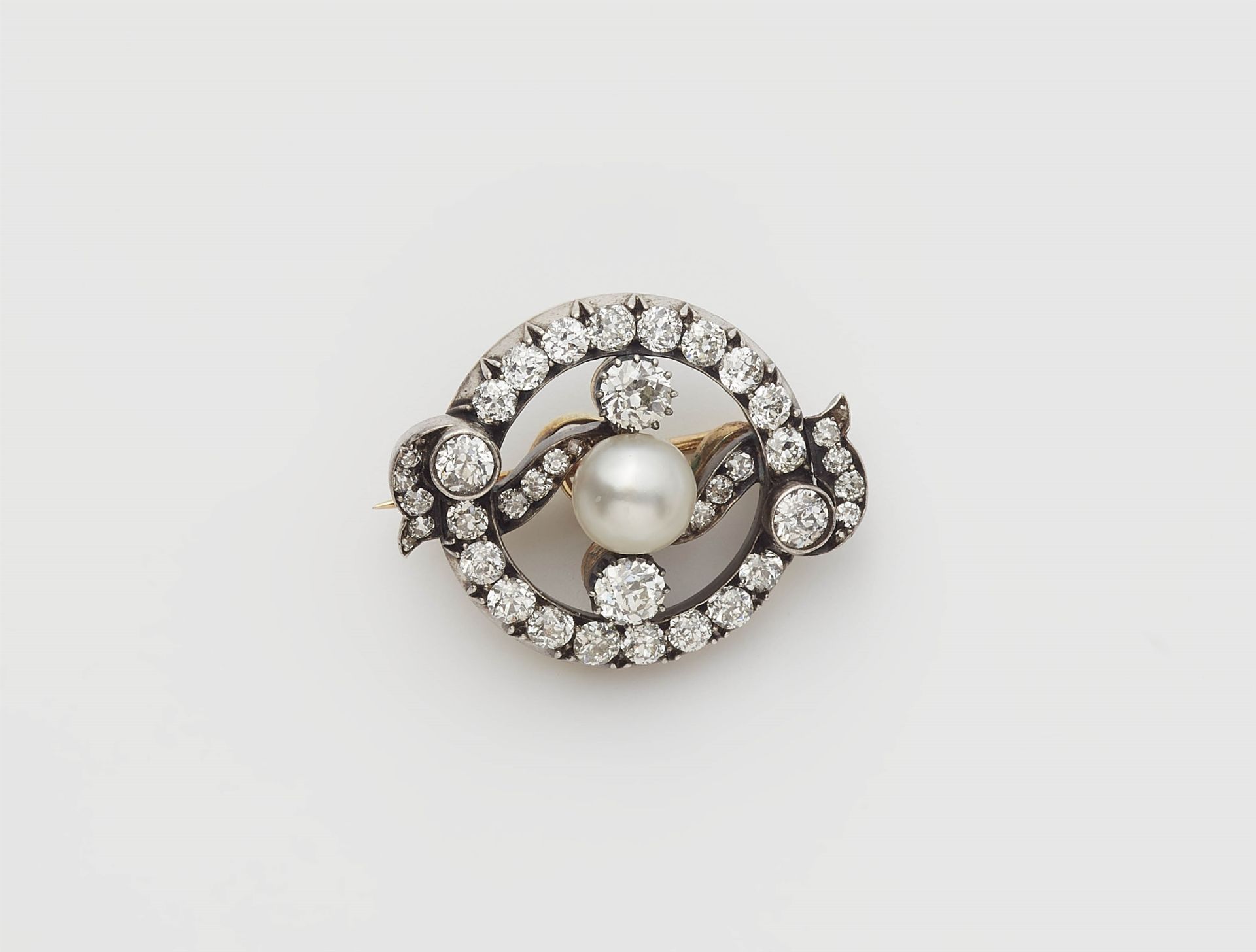 An Austrian 14k gold and European old-cut diamond brooch with a bouton pearl.