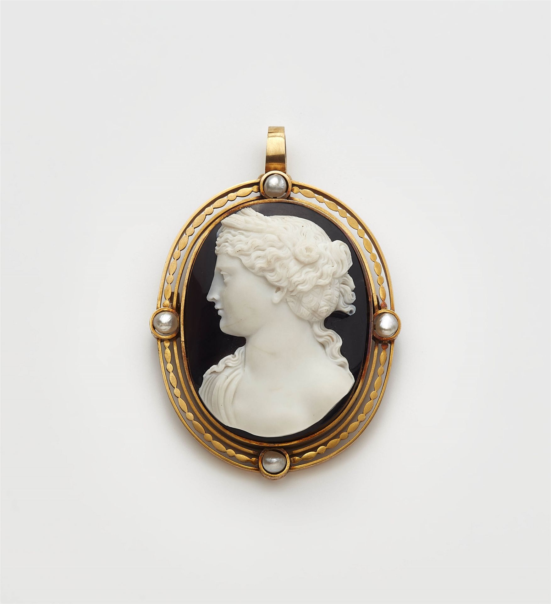 A 14k gold pearl pendant brooch with a layered agate cameo depicting Ceres.