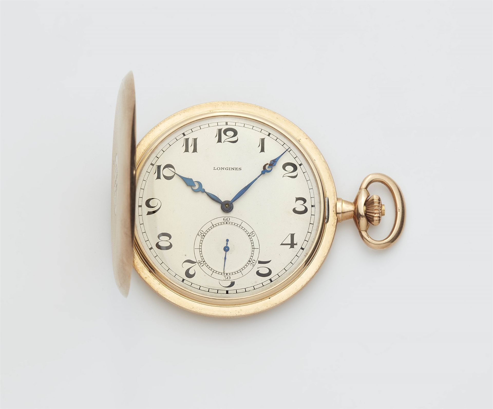 A 14k gold Longines Savonette pocket watch.