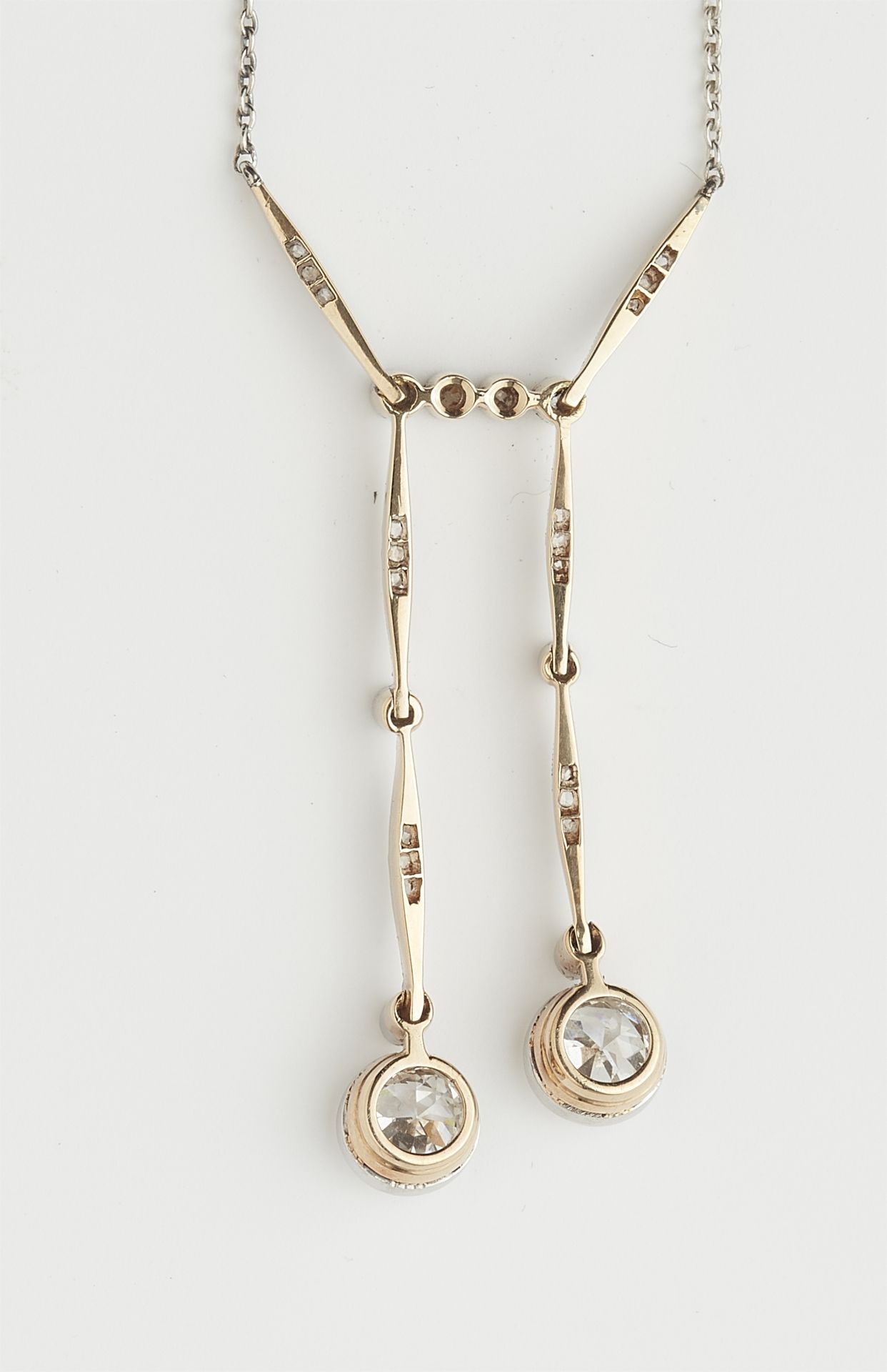 A 14k gold diamond negligé pendant necklace with two transitional-cut diamond solitaires. - Image 3 of 4