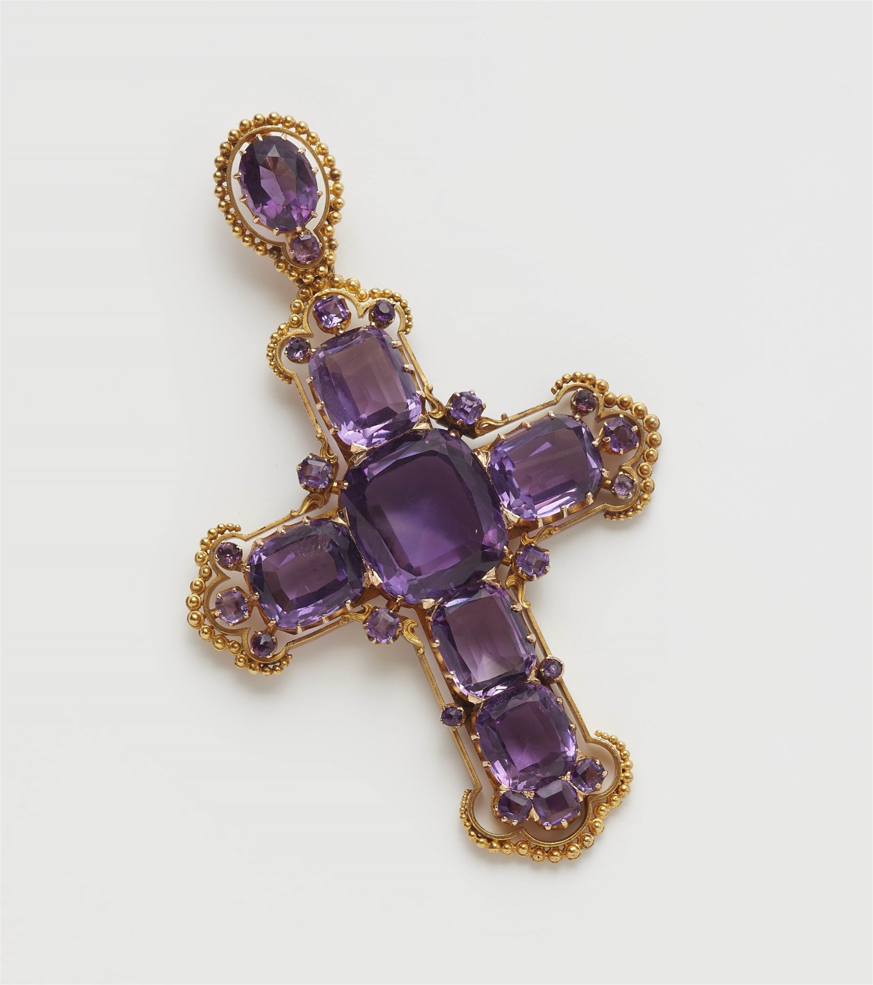 A historicist 14k gold and amethyst pectoral cross pendant.