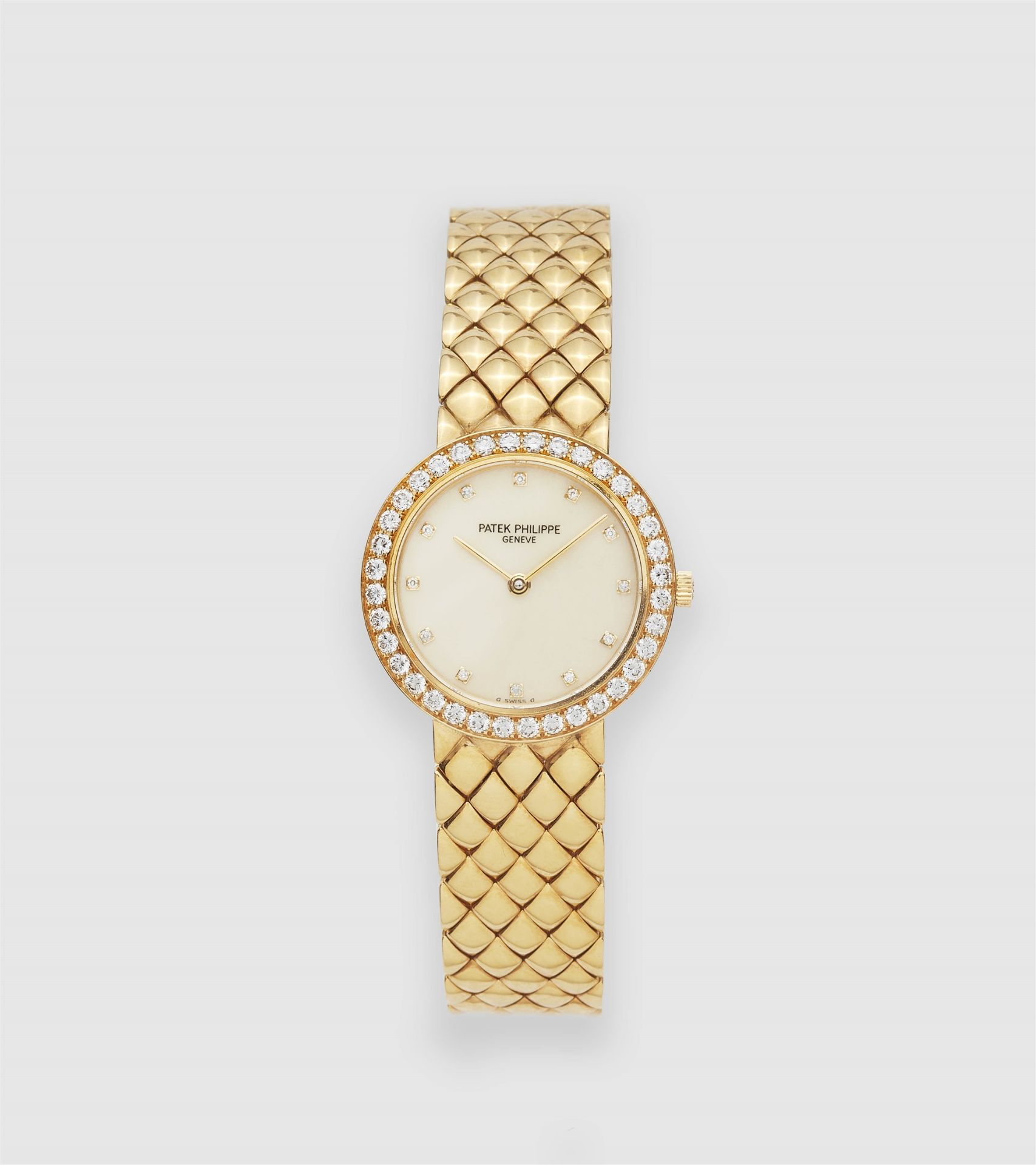 An 18k yellow gold and diamond quartz Patek Philippe ladies' wristwatch.
