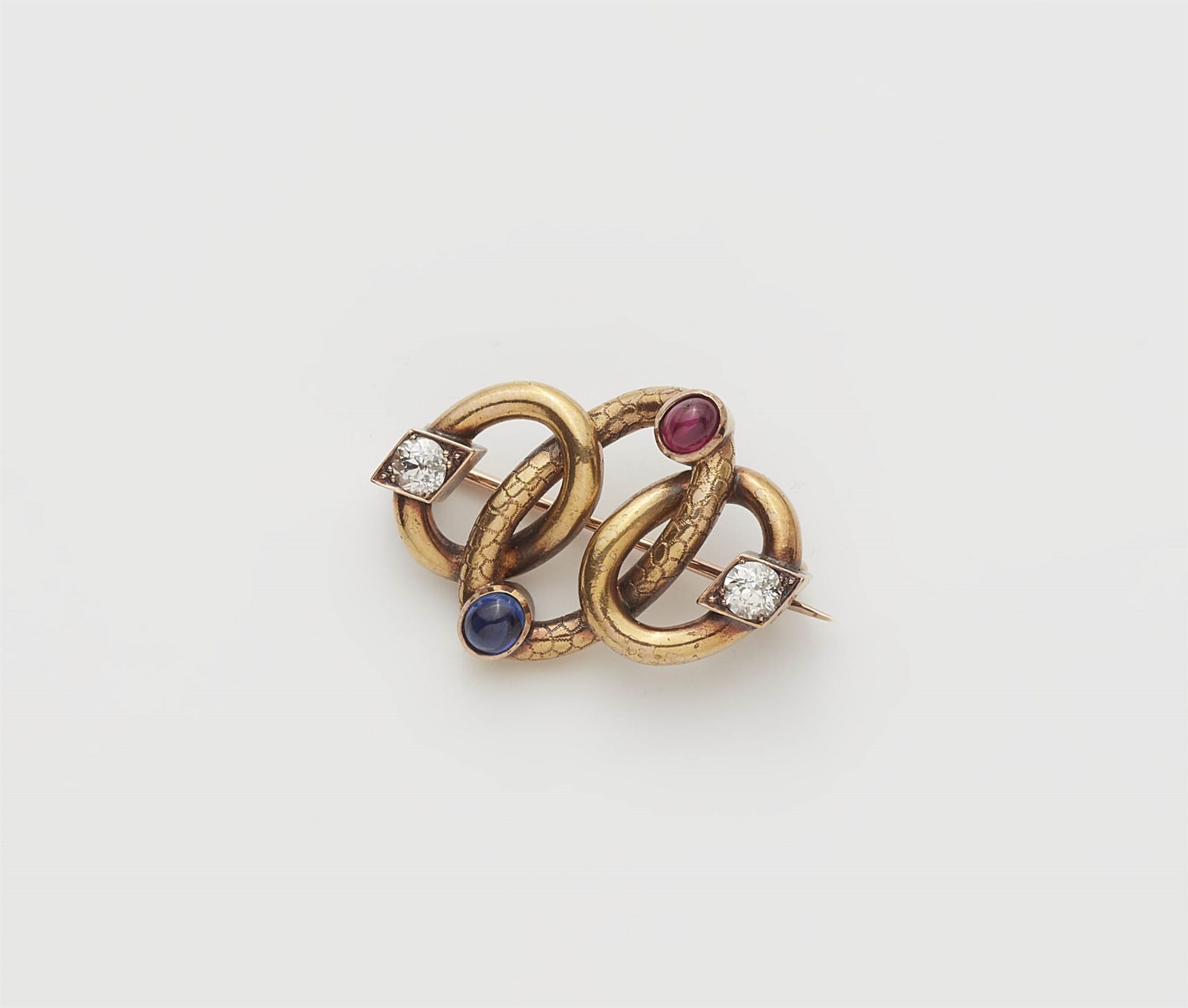 A late 19th century 14k gold sapphire ruby and diamond brooch.