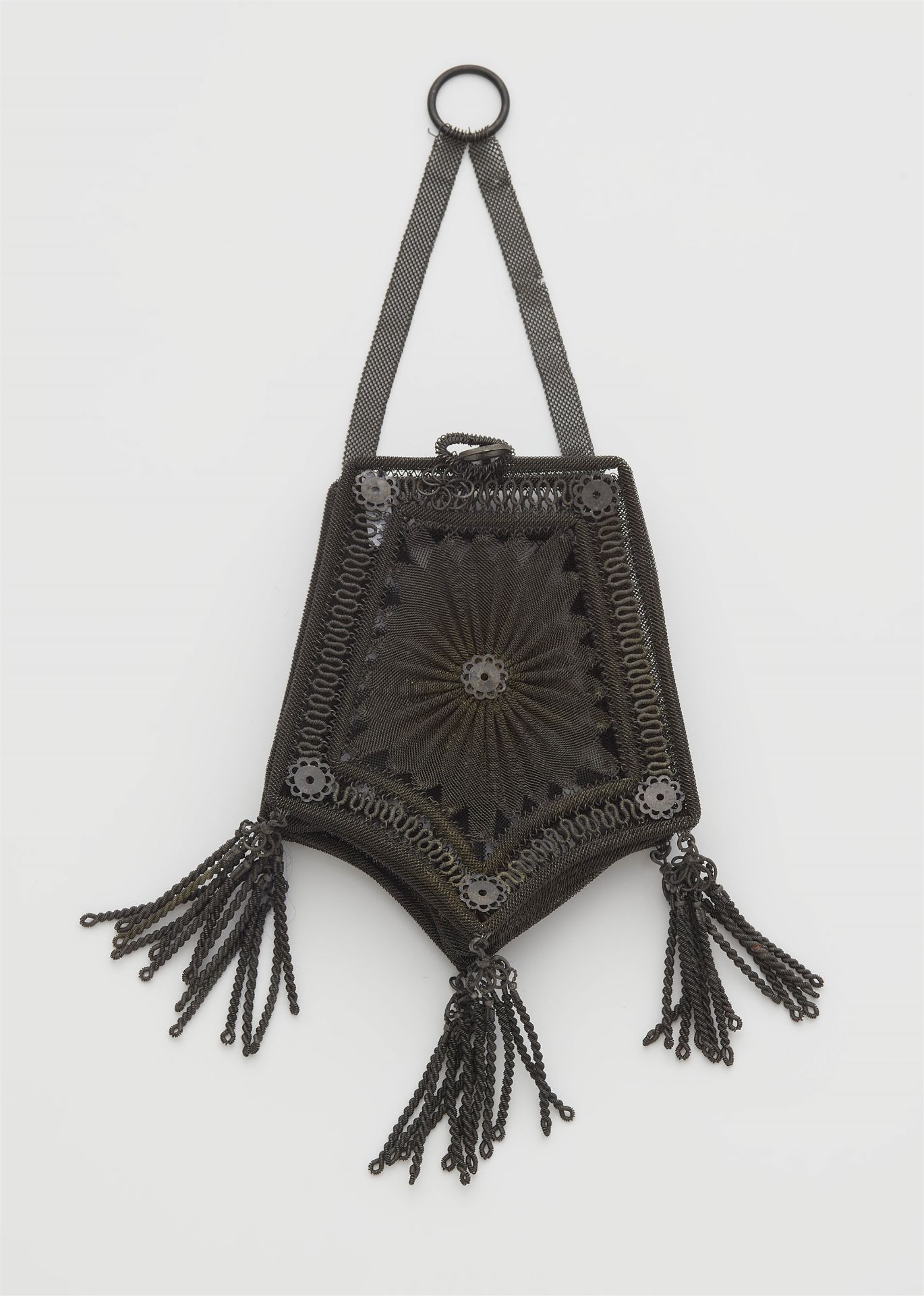 An small Berlin or Viennese gauze-like pouch woven from steel wire with tassel pendants.