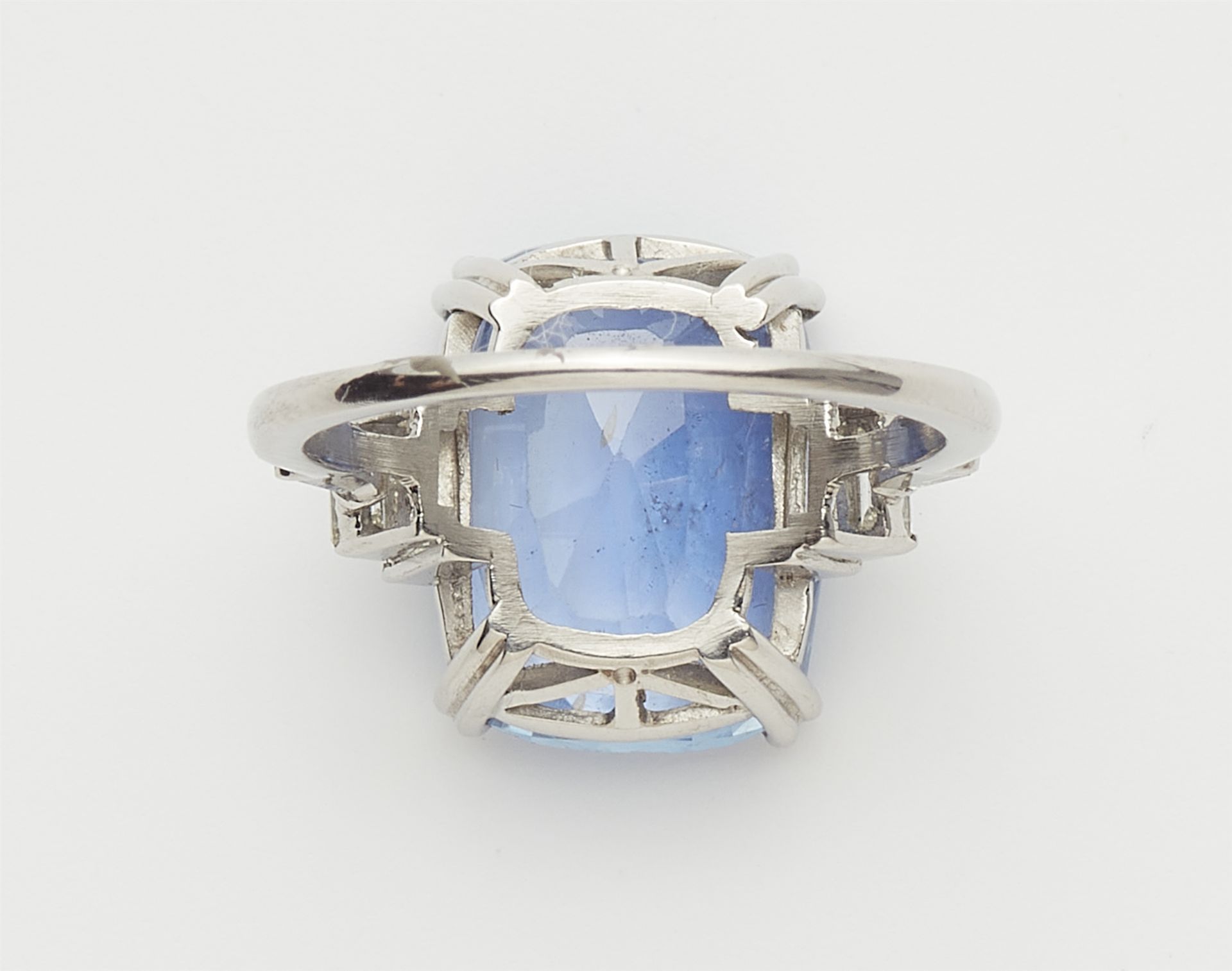 A platinum diamond and natural Ceylon sapphire ring. - Image 2 of 3