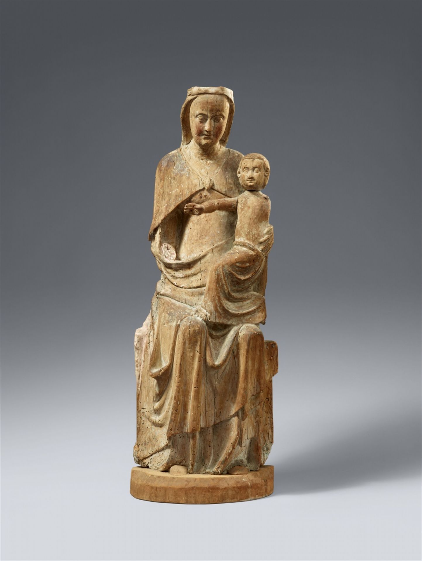 A carved wood figure of the Virgin Enthroned, presumably Maasland, 1st half 14th century