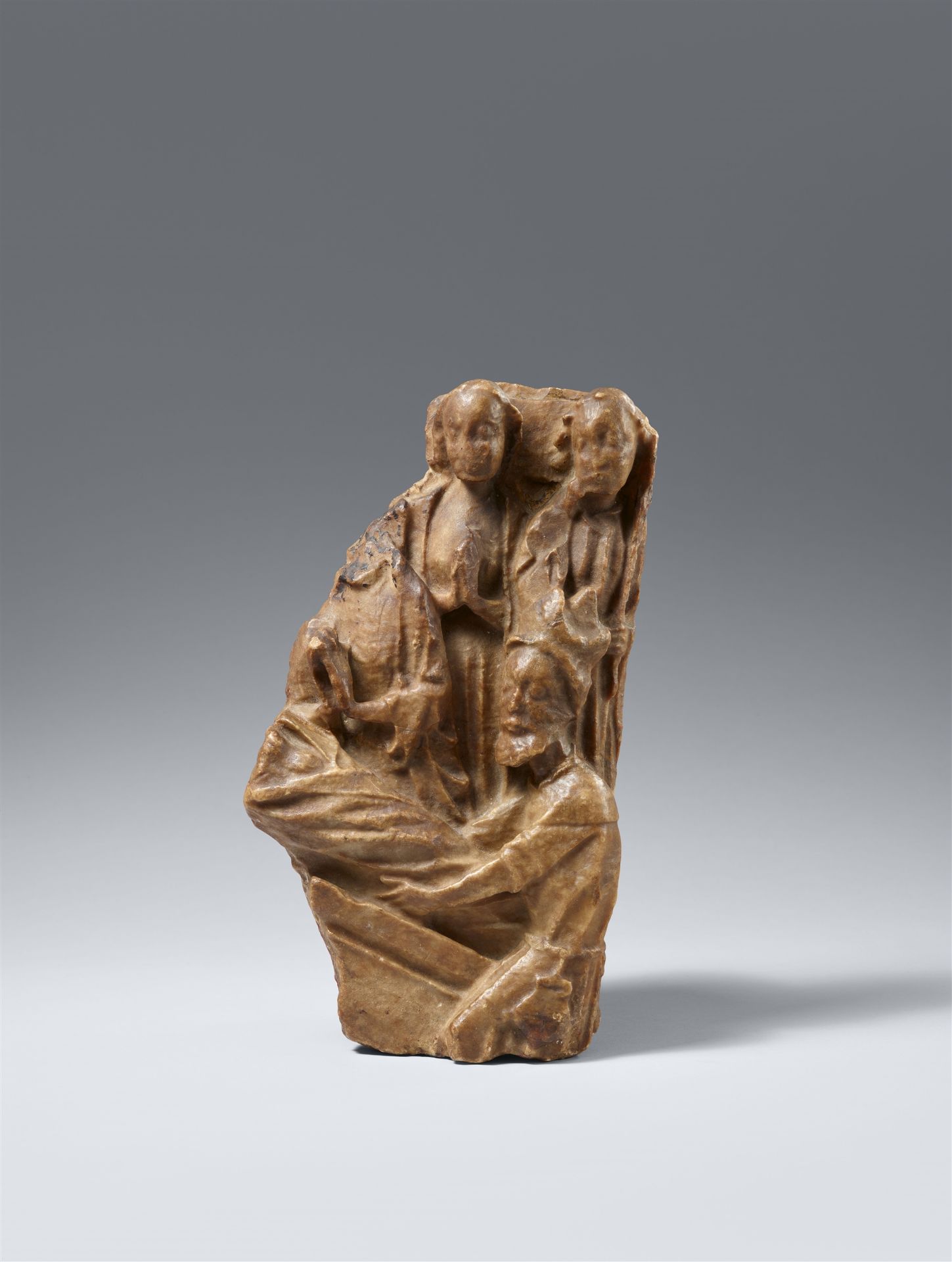 A fragment of a 15th century Nottingham alabaster relief of the Entombment