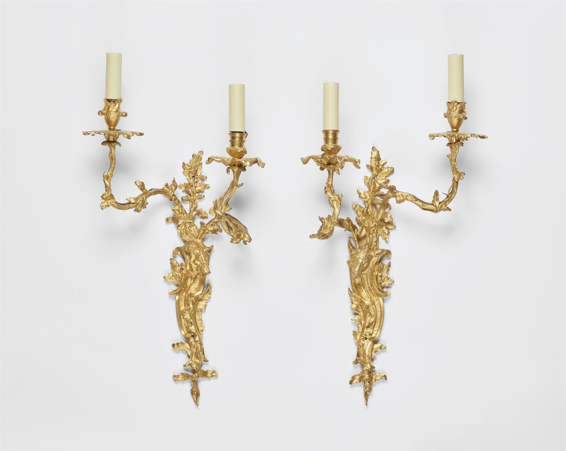 A pair of ormolu appliques with hunting trophies