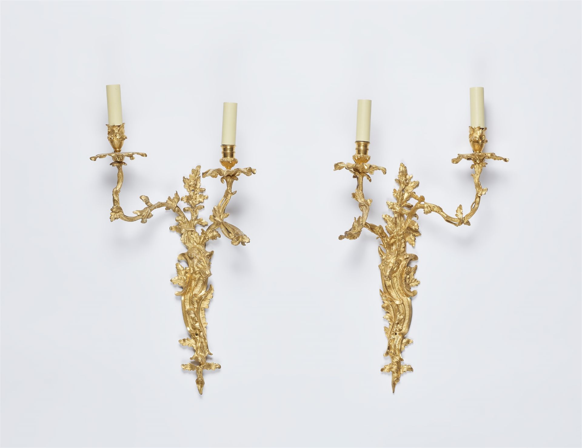 A pair of ormolu appliques with hunting trophies