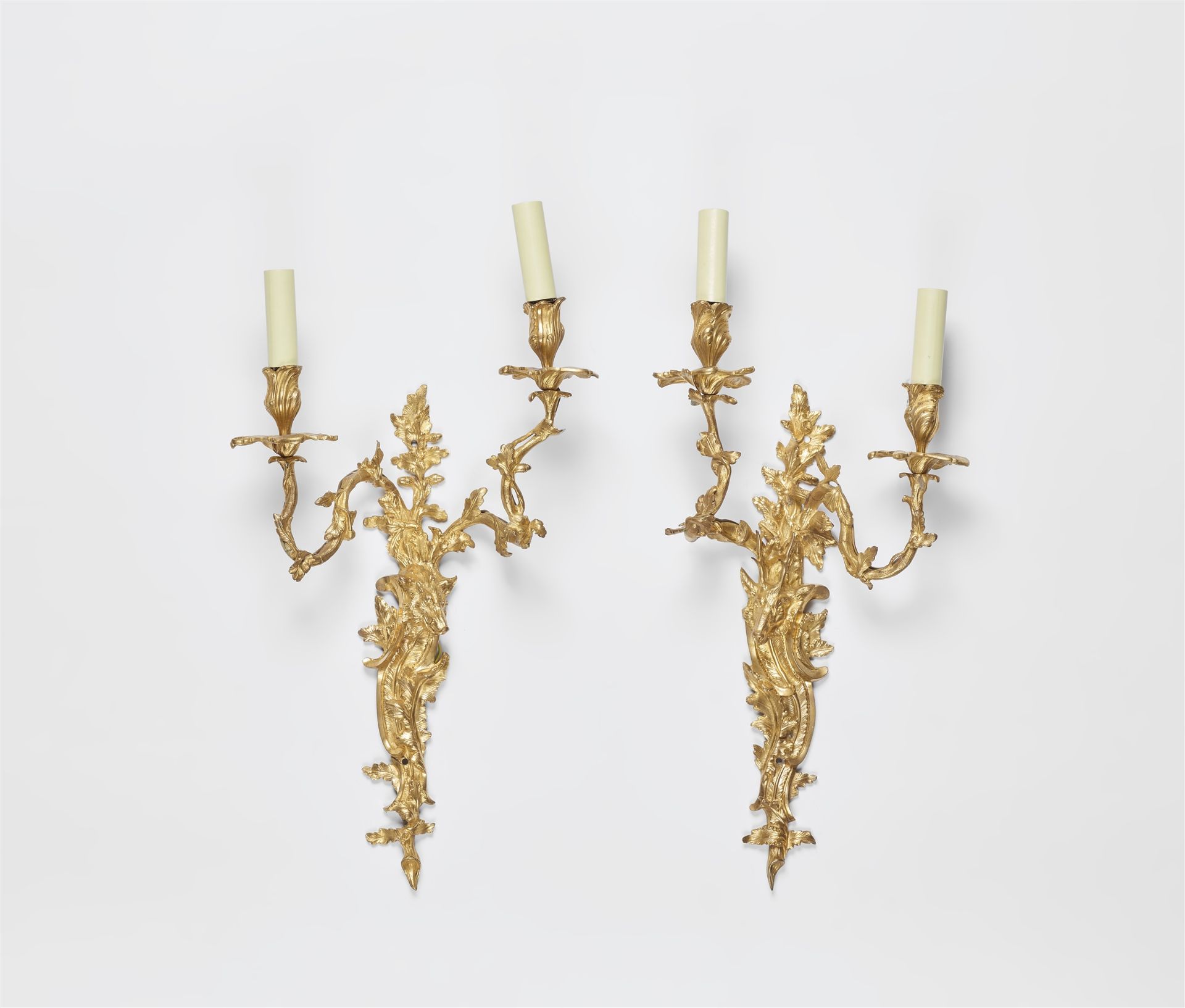 A pair of ormolu appliques with hunting trophies