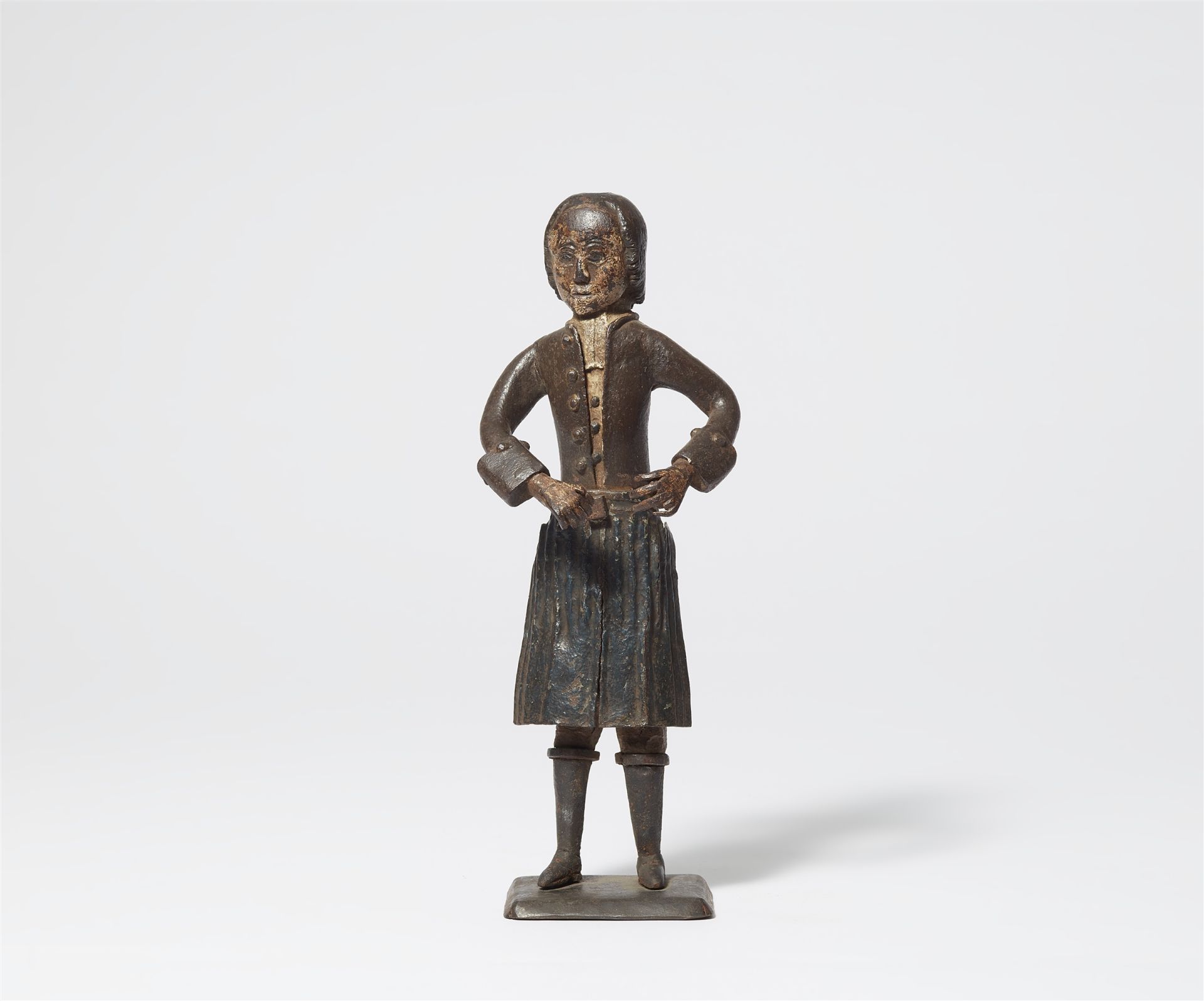 An 18th century German painted iron votive figure of a smith