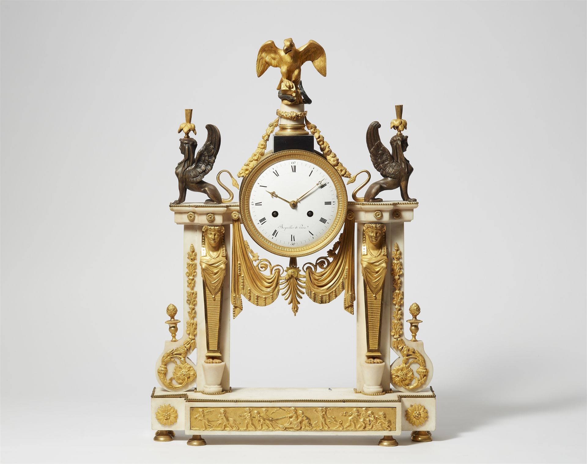 A Parisian gilt and patinated bronze pendulum clock "à l'aigle"