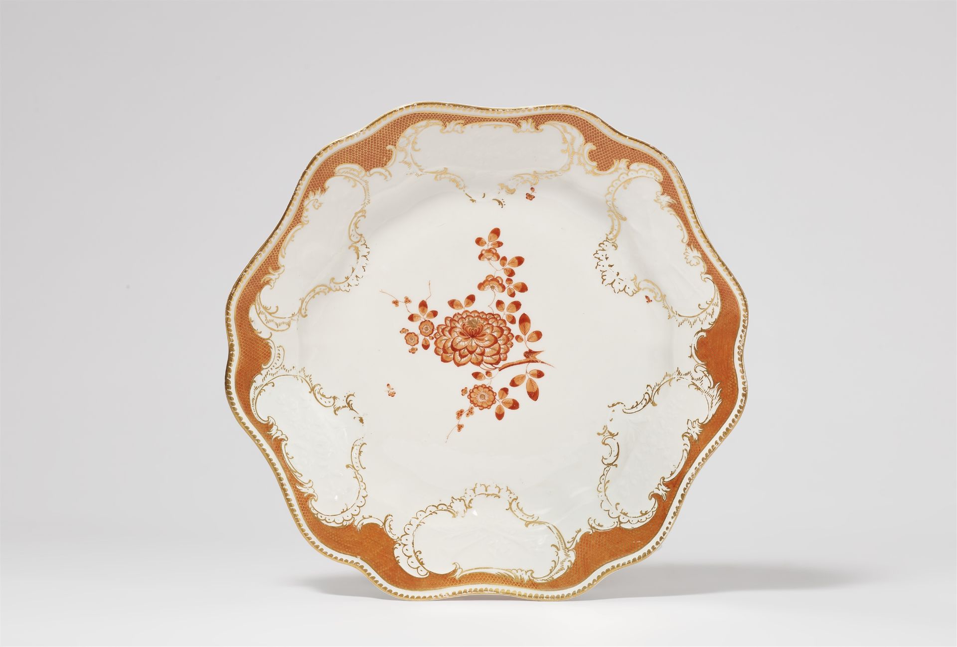 A Meissen porcelain platter from the service with iron red mosaic borders