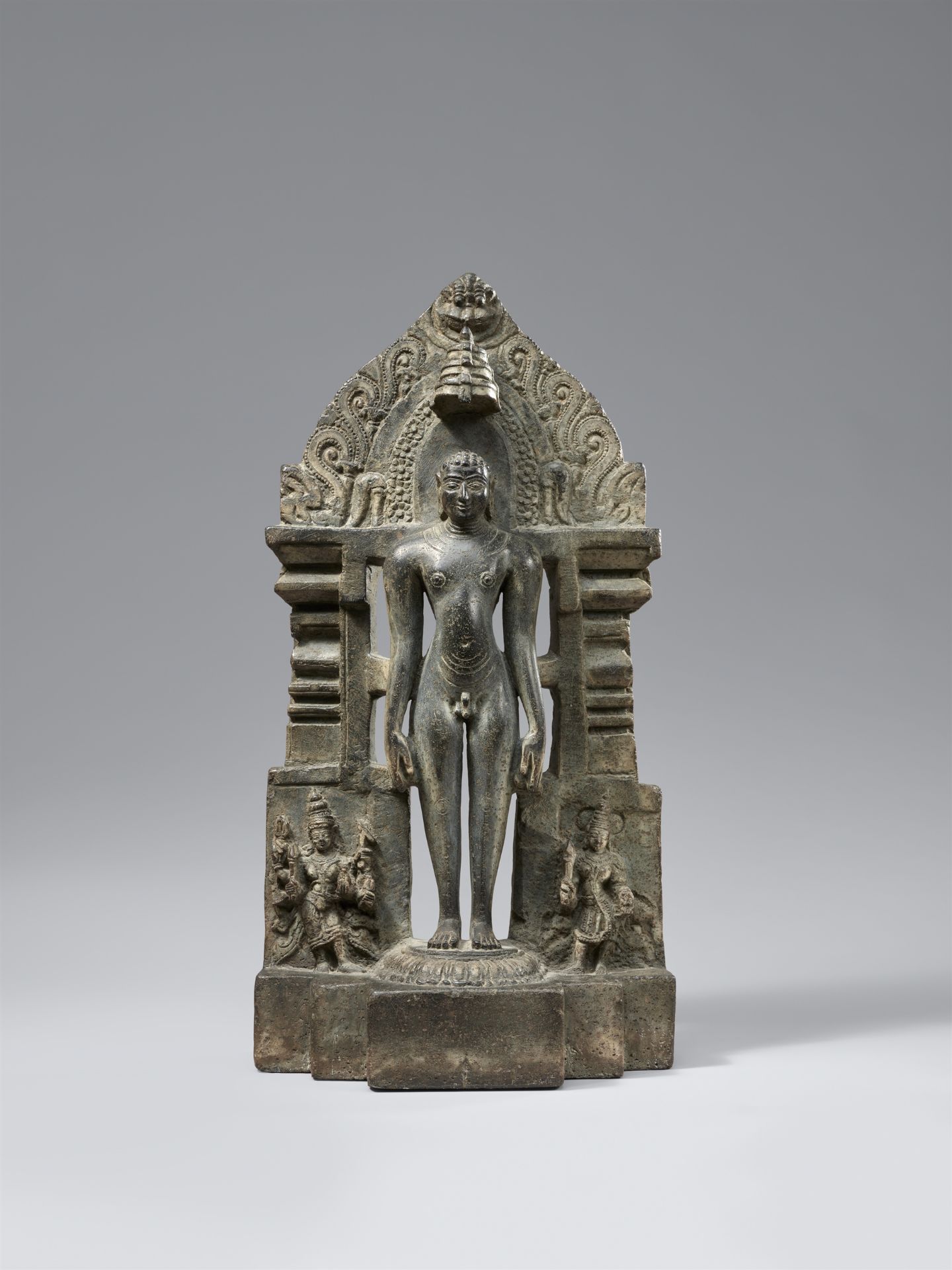 A black stone Jain stele of a tirthankara. India, Karnataka. 12th/14th century