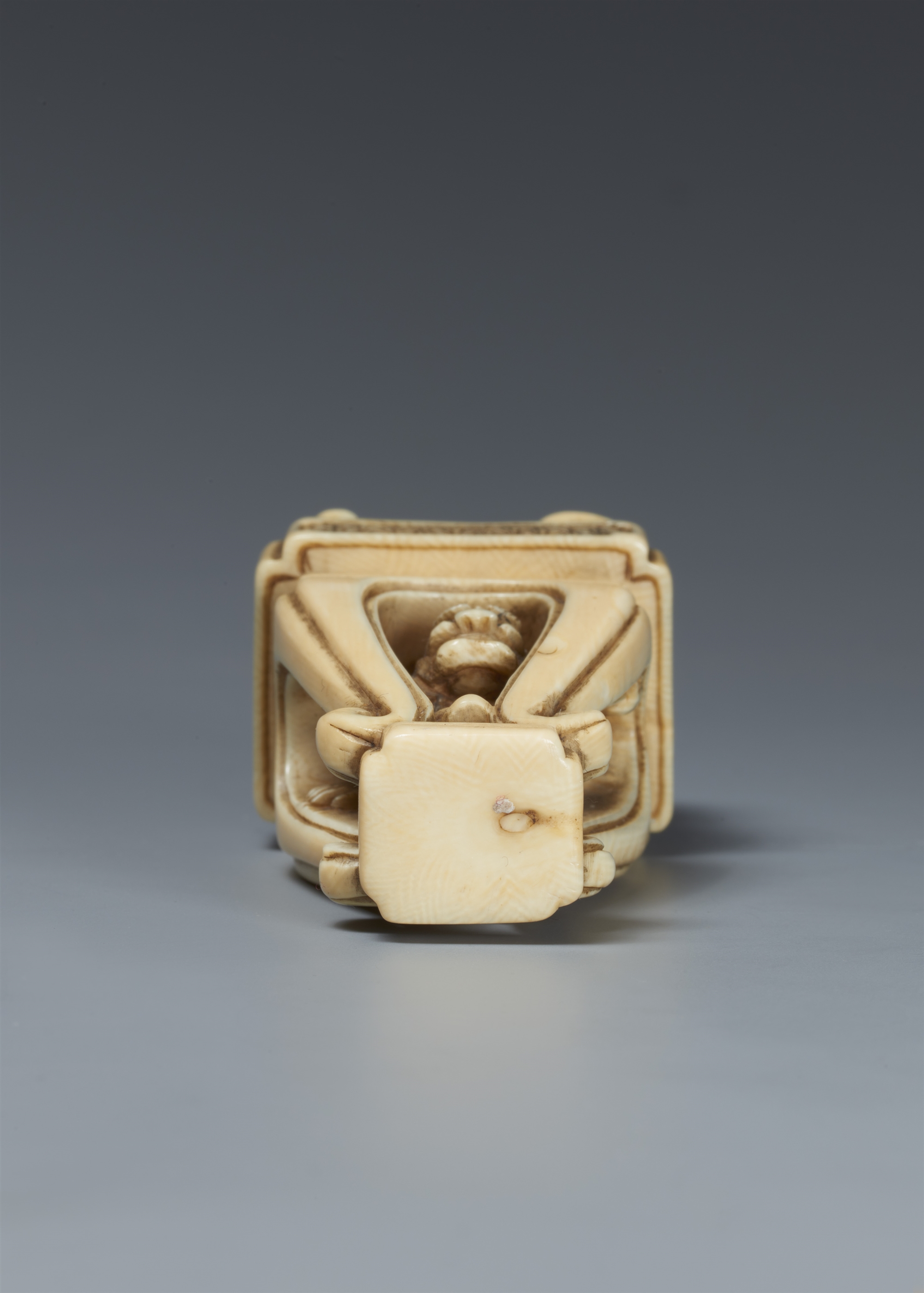 An ivory netsuke of Hotei on a high Chinese-style table. 19th century - Image 2 of 5