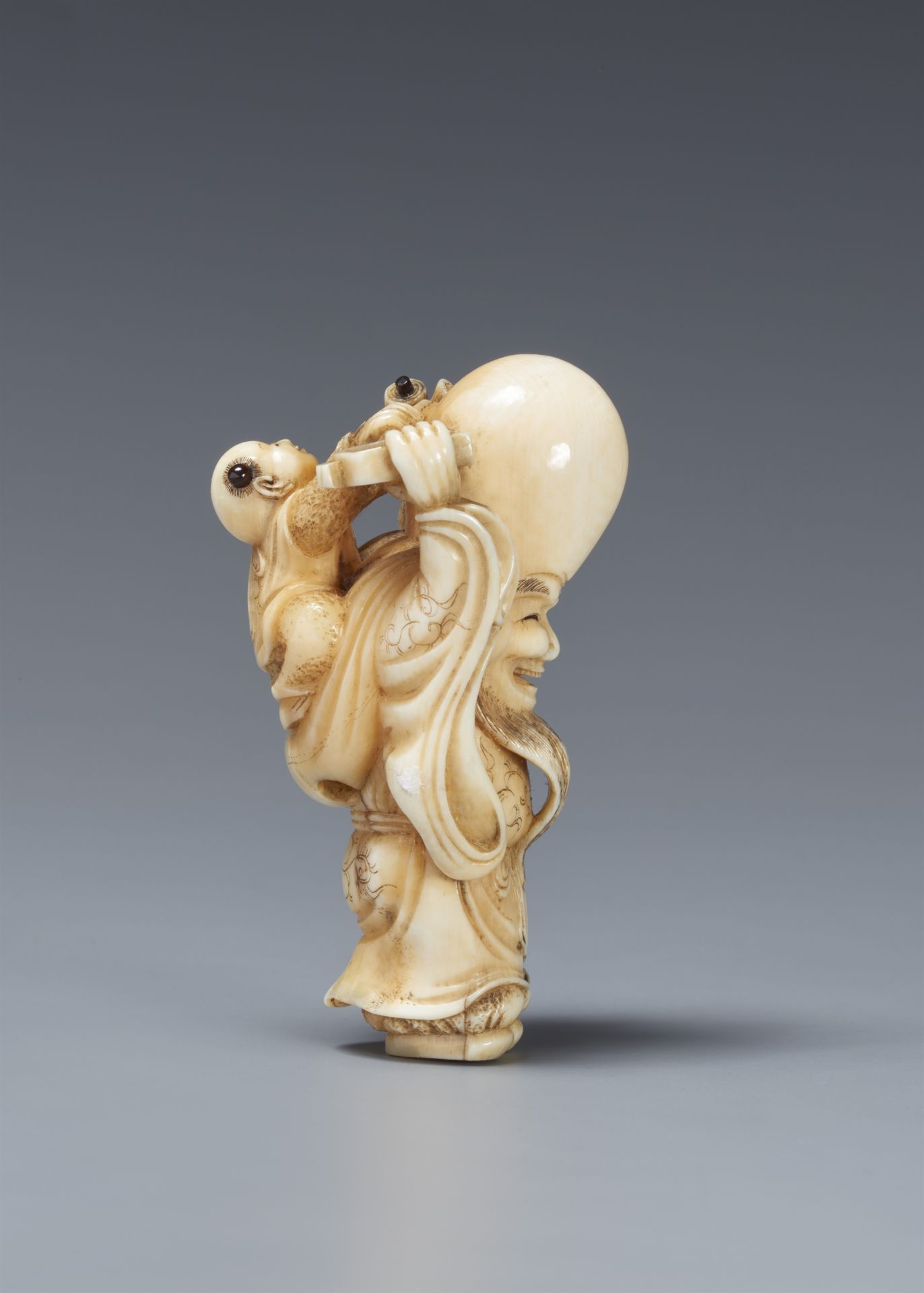 An amusing ivory netsuke of Fukurokuju and karako 19th century - Image 4 of 6