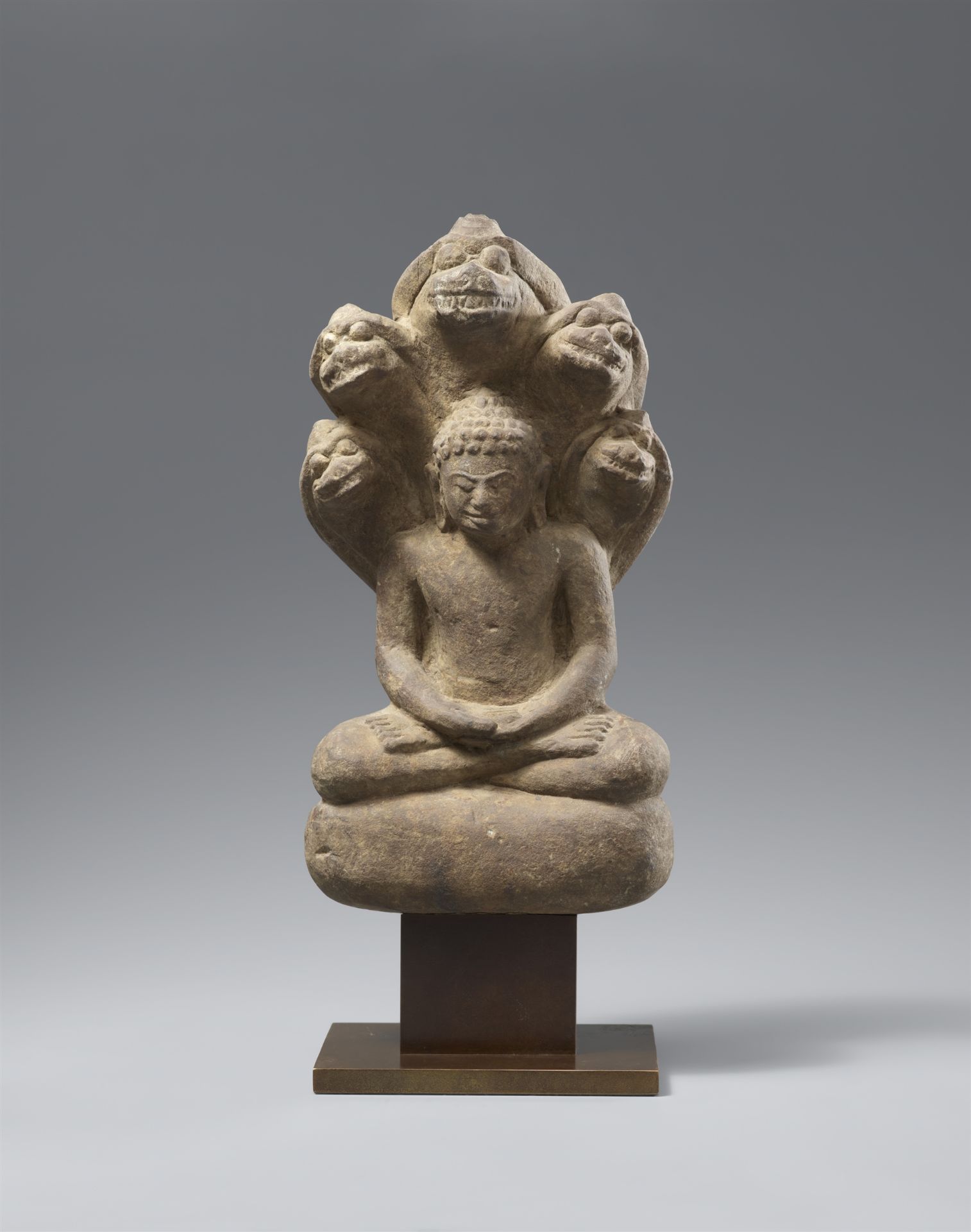 A small Mon stone Buddha Muchalinda. Thailand, Mon-Dvaravati period, 7th/8th century