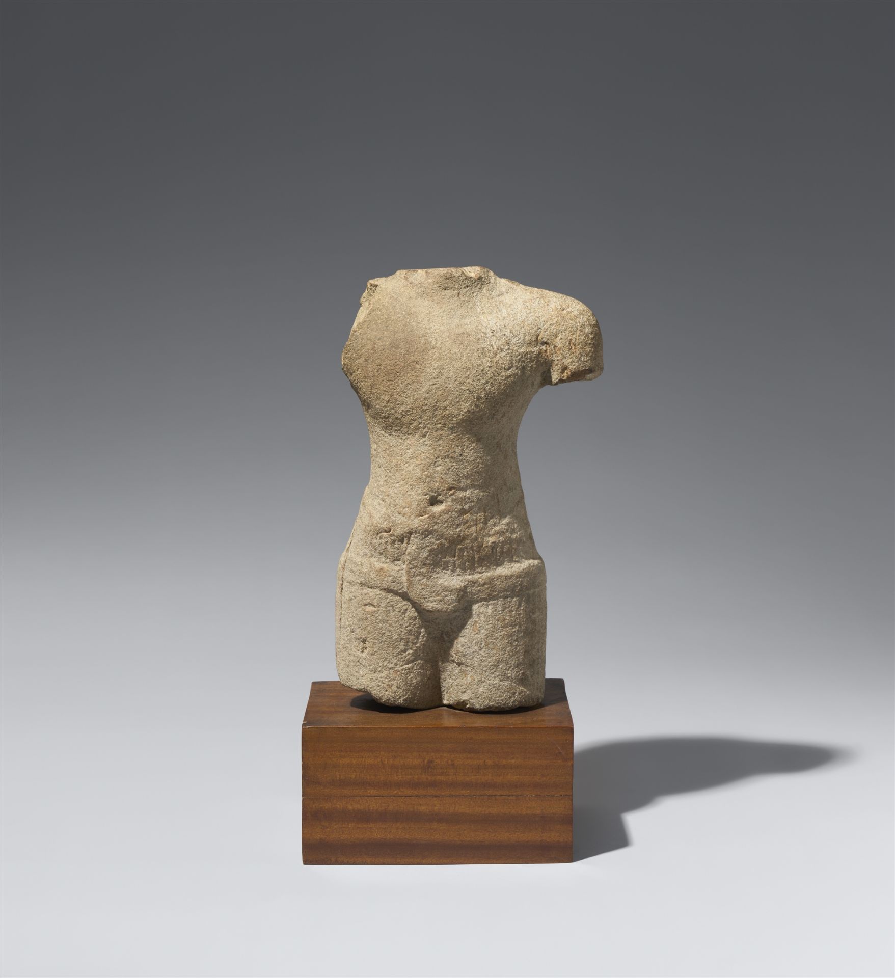 A Baphuon-style sandstone torso. Cambodia. Second half 11th century