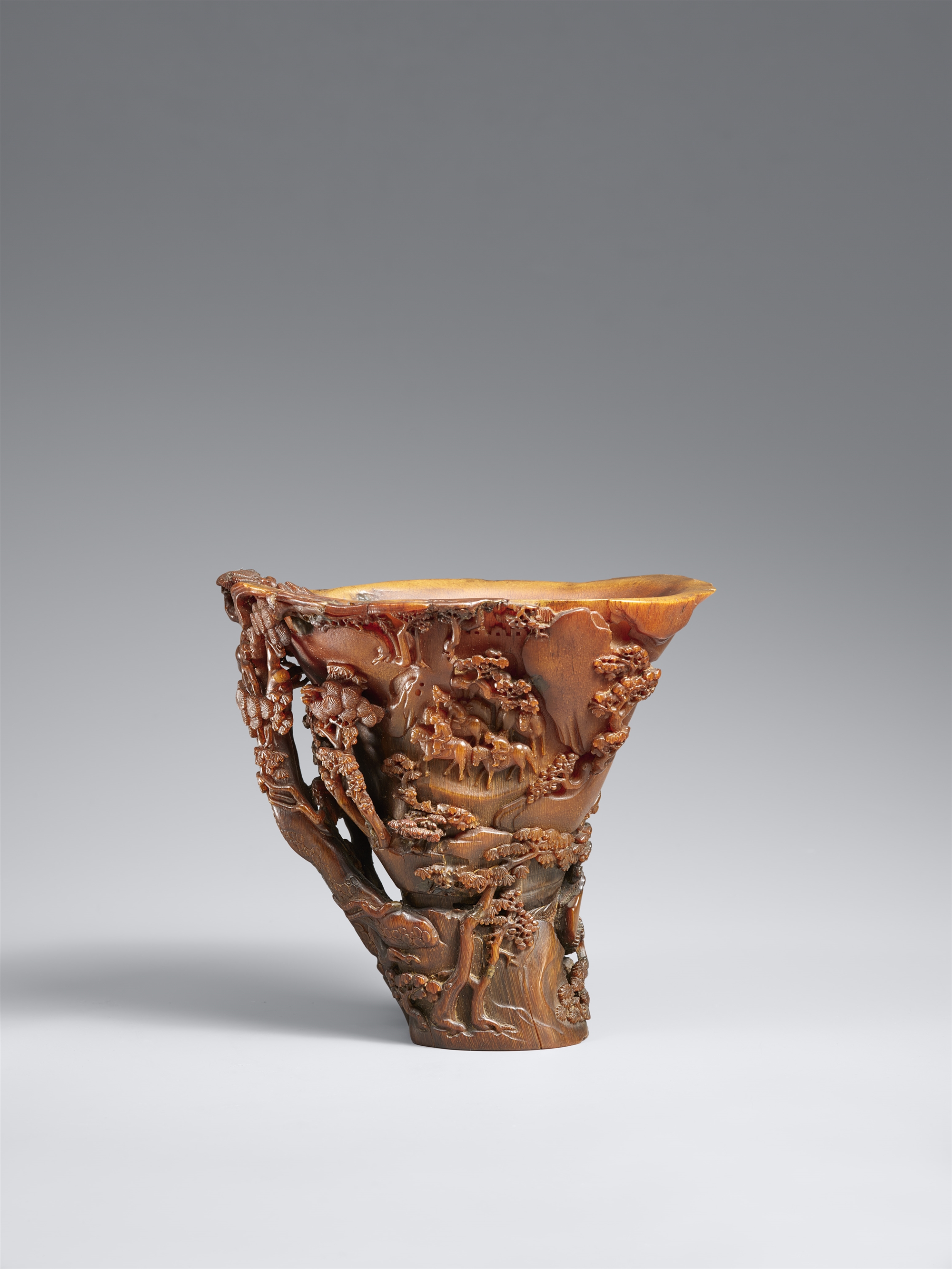 A superbly carved rhinoceros horn libation cup. 17th century
