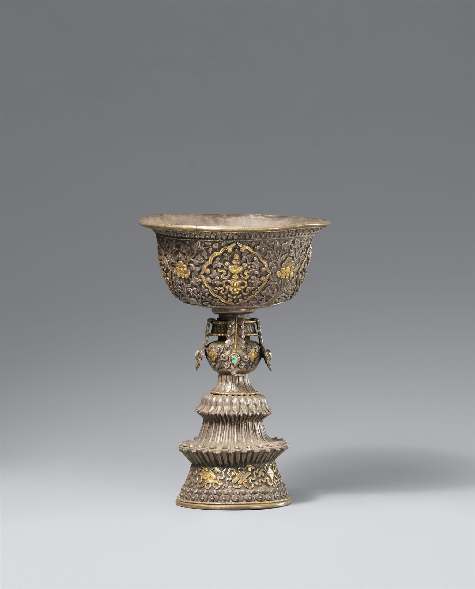 A bajixiang repoussé butter lamp (offering lamp). Tibet, 19th century