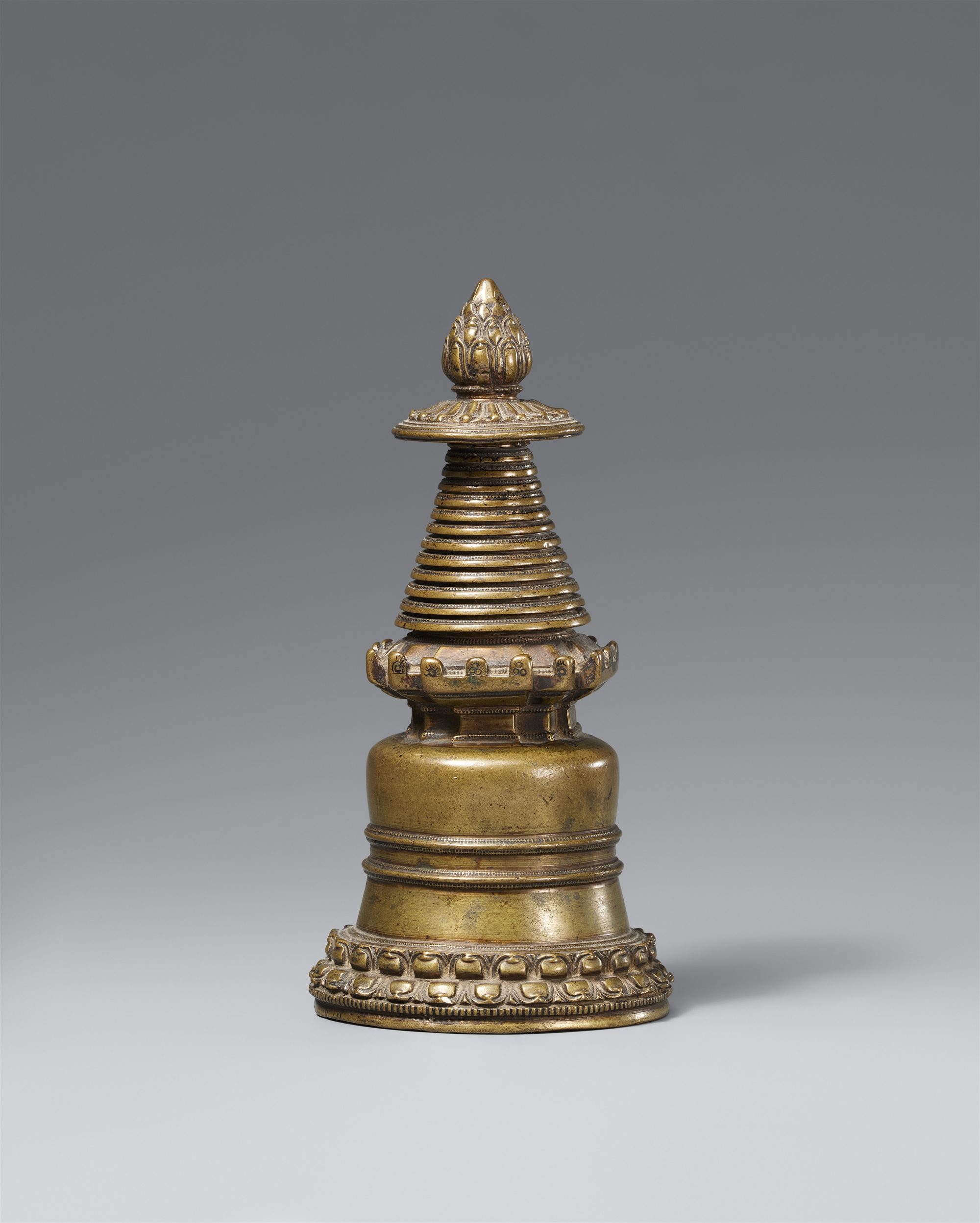 A copper alloy stupa reliquary (mChod-rten). Tibet, 13th/14 century