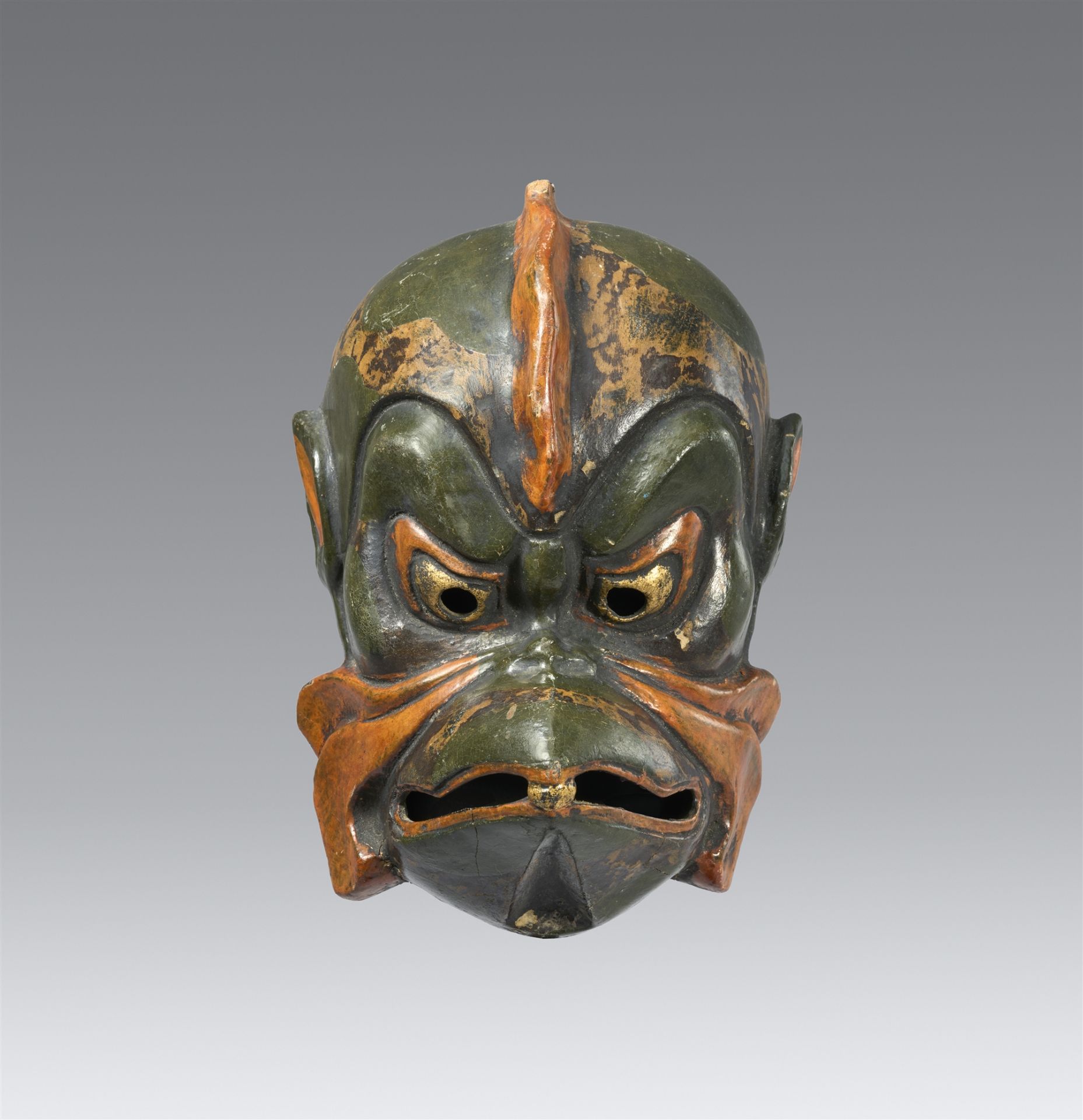 A lacquered wood gigaku mask. Meiji period