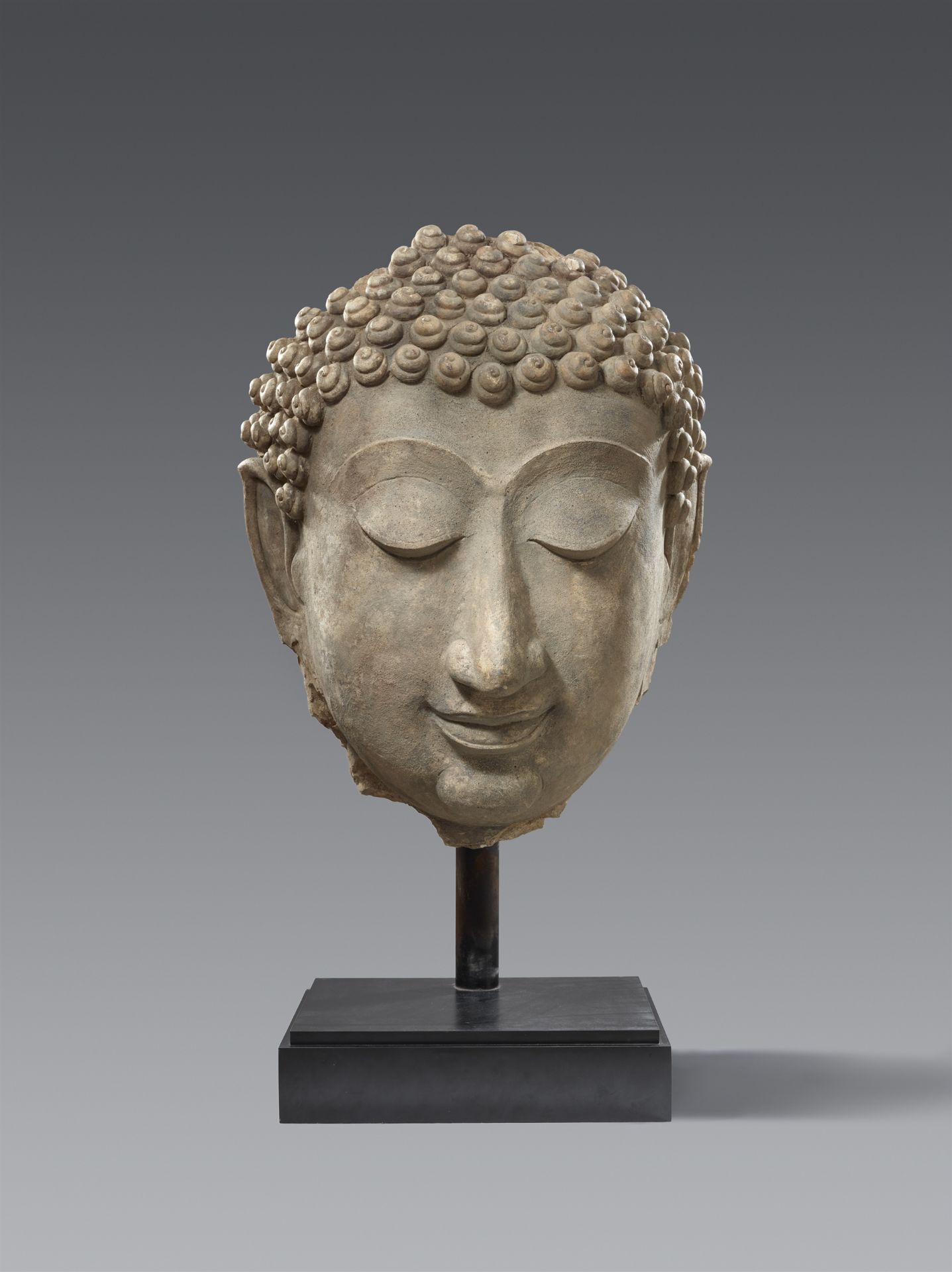 A monumental Sukhothai stucco head of a Buddha, Thailand. 14th/15th century