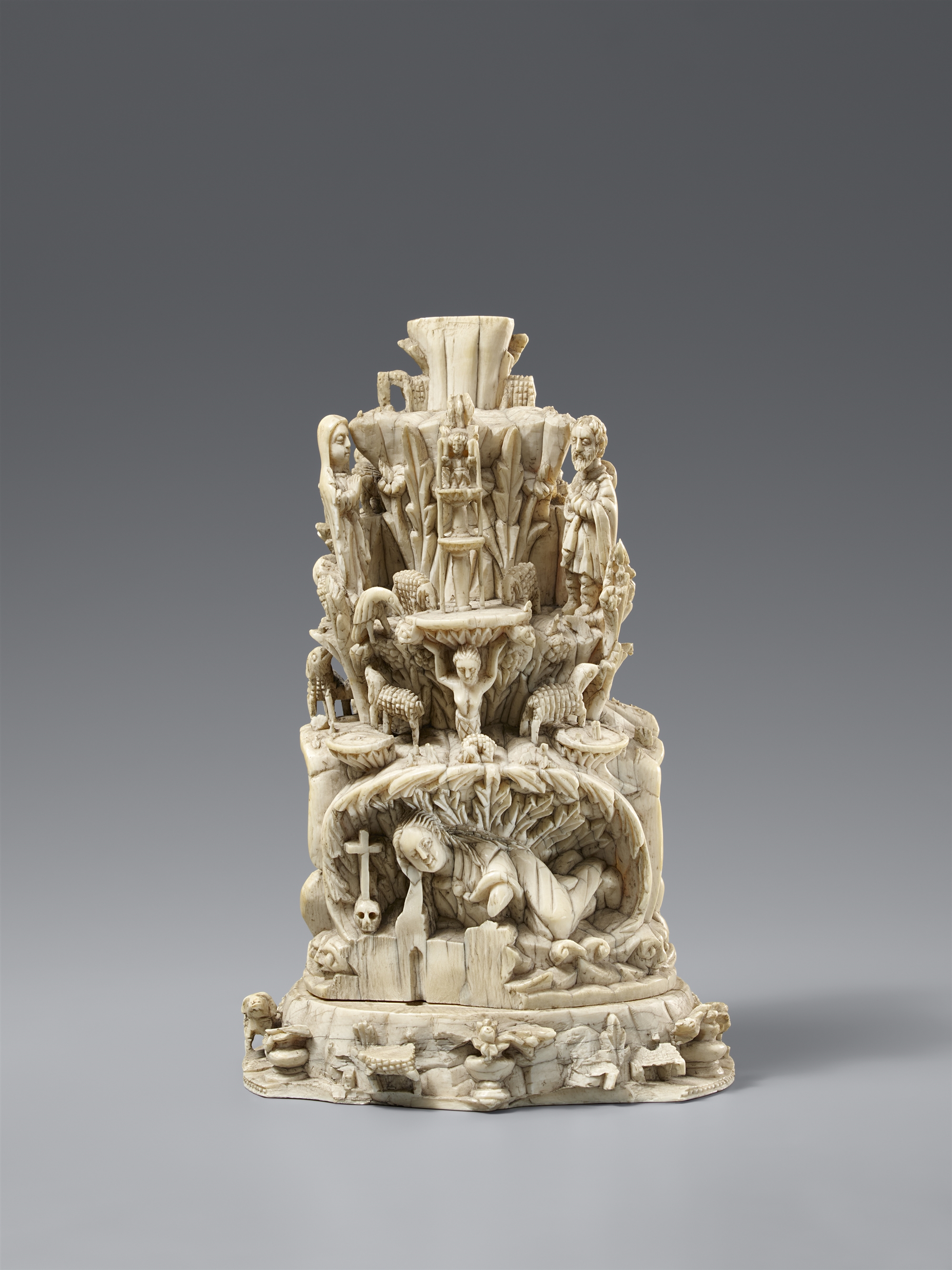 An Indo-Portuguese ivory mountain socle of the Christ Child as the Good Shepherd. India, Goa. Ca. 16