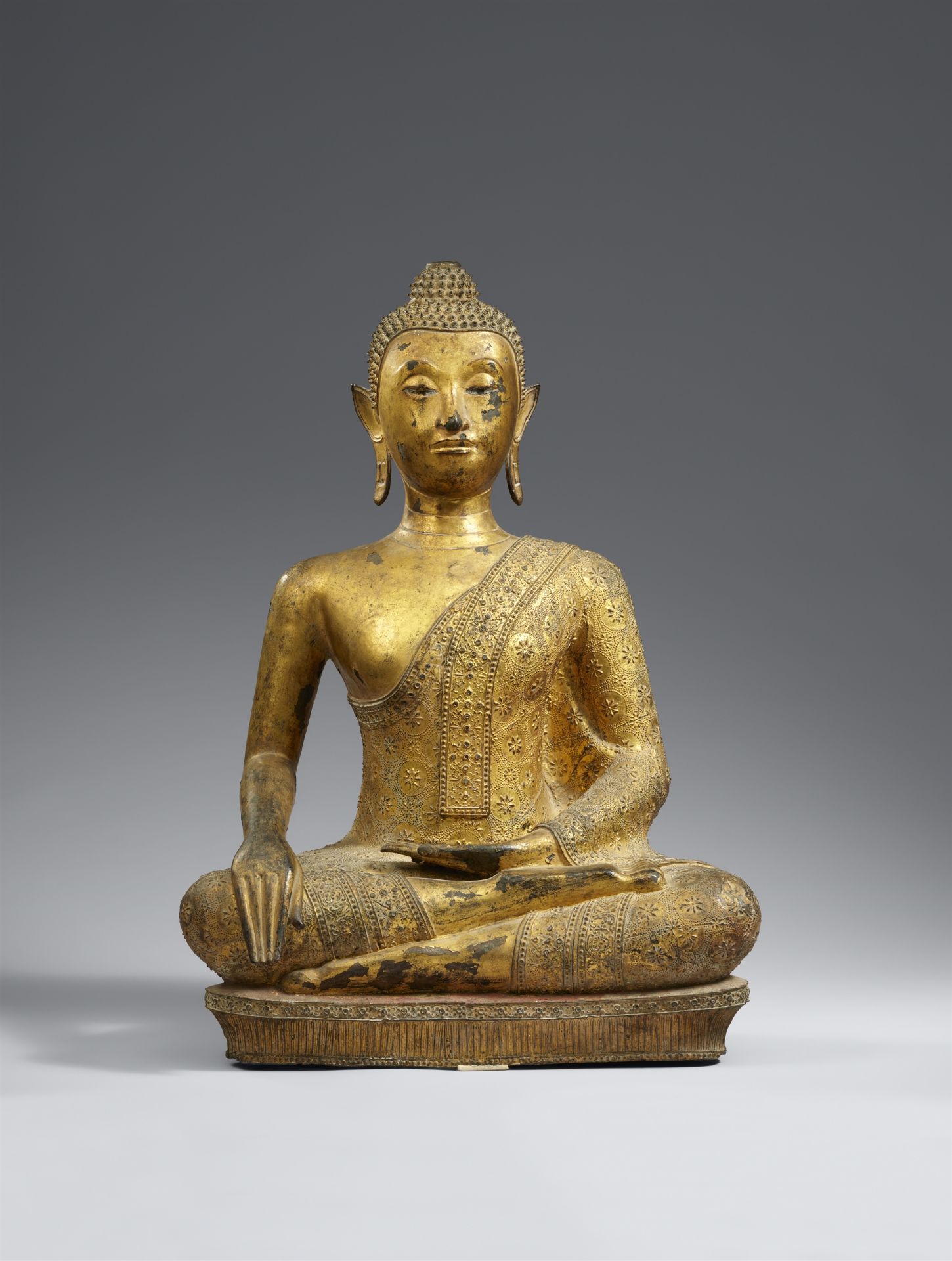 A Ratanakosin gilded and lacquered bronze figure of Buddha Shakyamuni. Thailand. 19th century